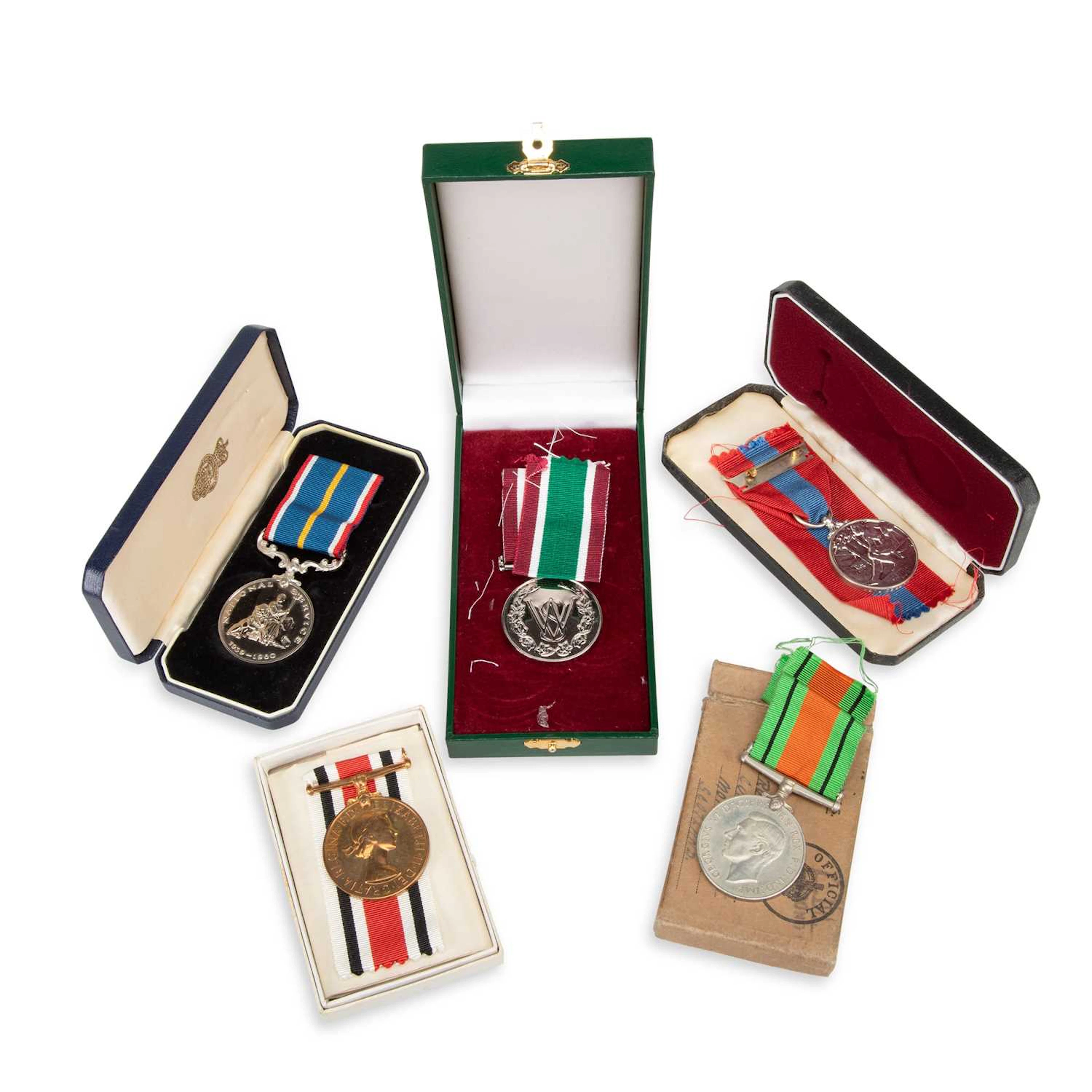A GROUP OF MEDALS AND WHISTLES