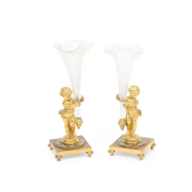 A PAIR OF FRENCH GILT BRONZE AND CHAMPLEVÉ ENAMEL FIGURAL VASES
