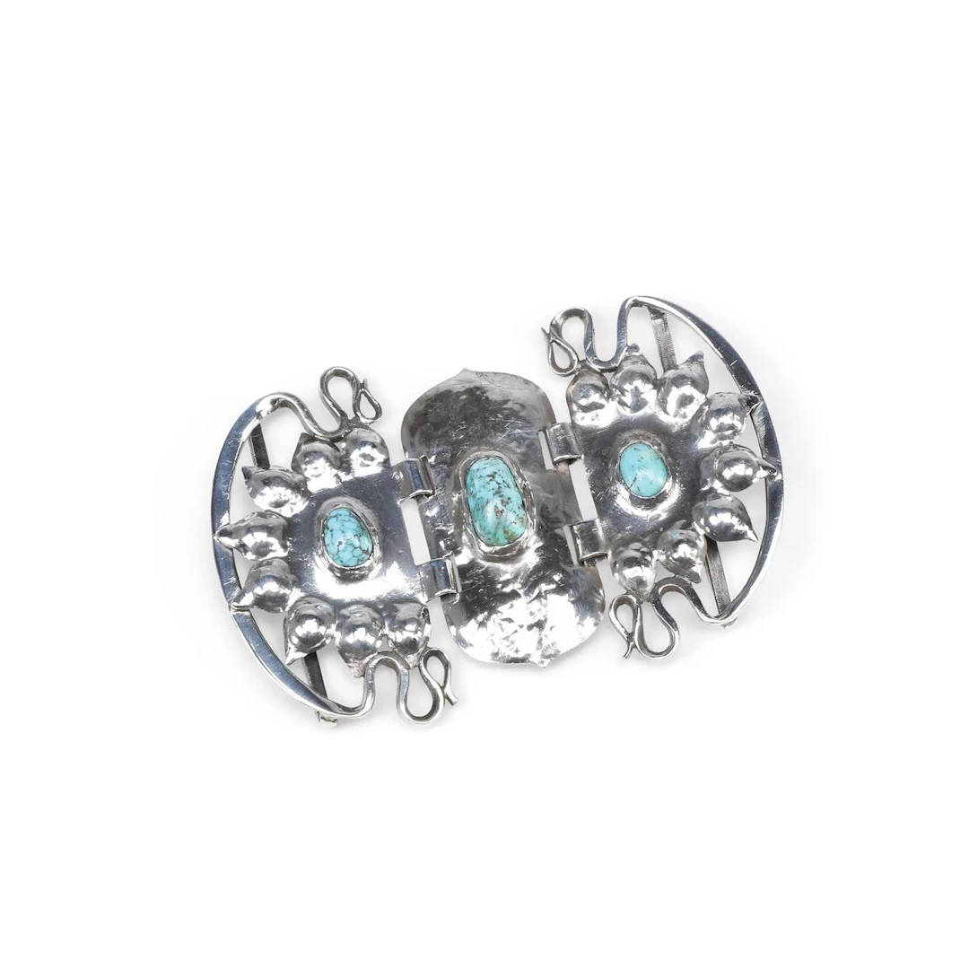 A LIBERTY & CO SILVER AND TURQUOISE BELT BUCKLE