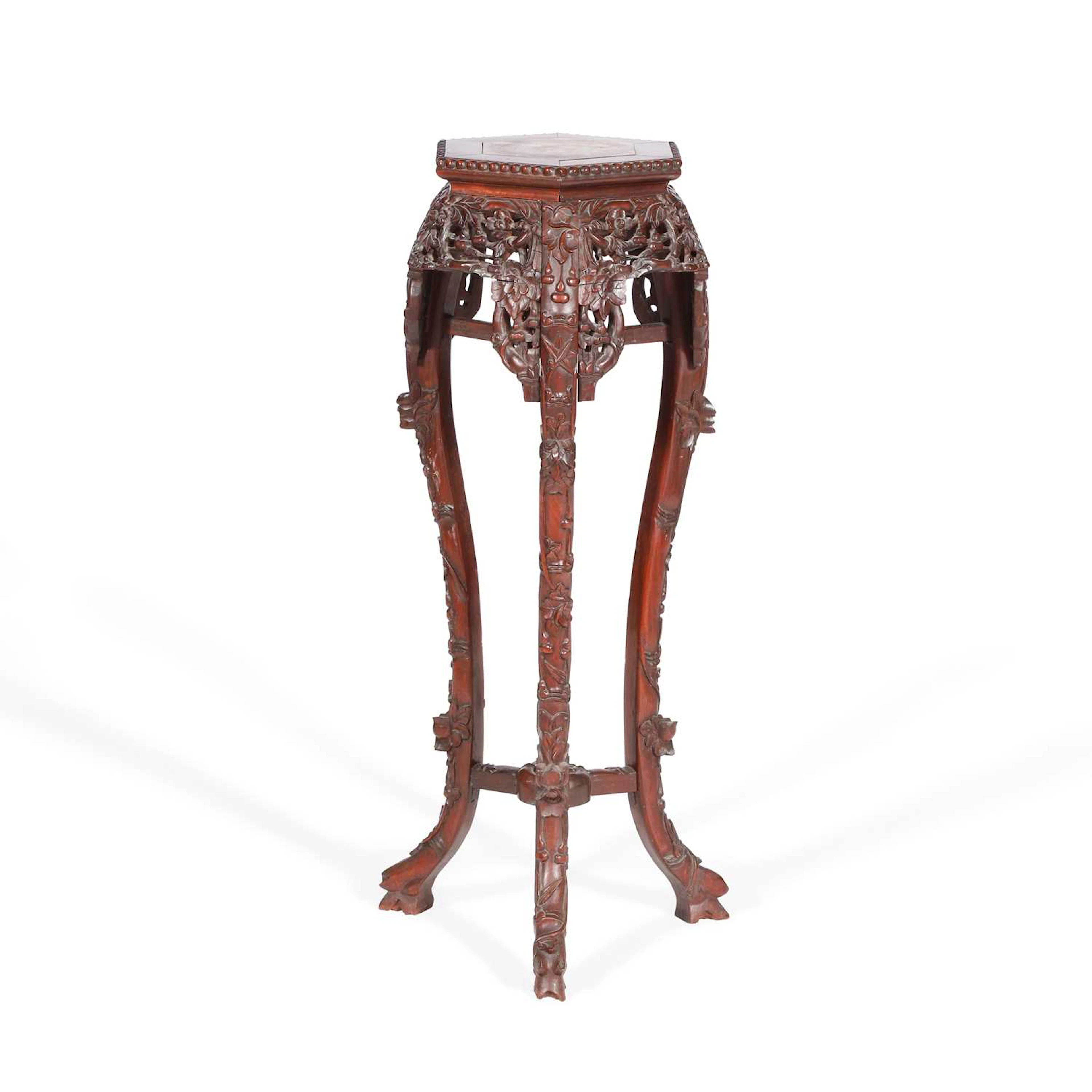 A CHINESE CARVED HARDWOOD STAND