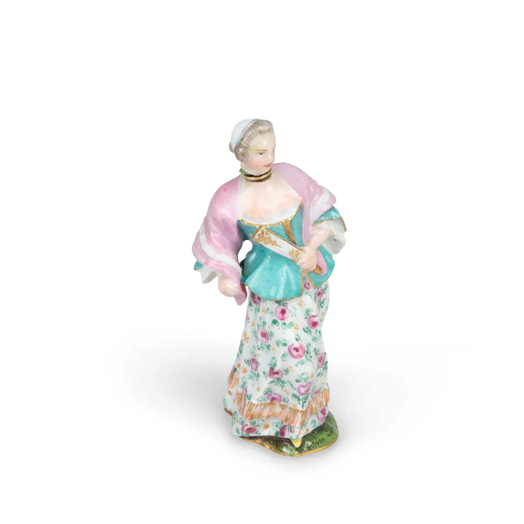 A PORCELAIN SCENT BOTTLE MODELLED AS A LADY WITH A FAN