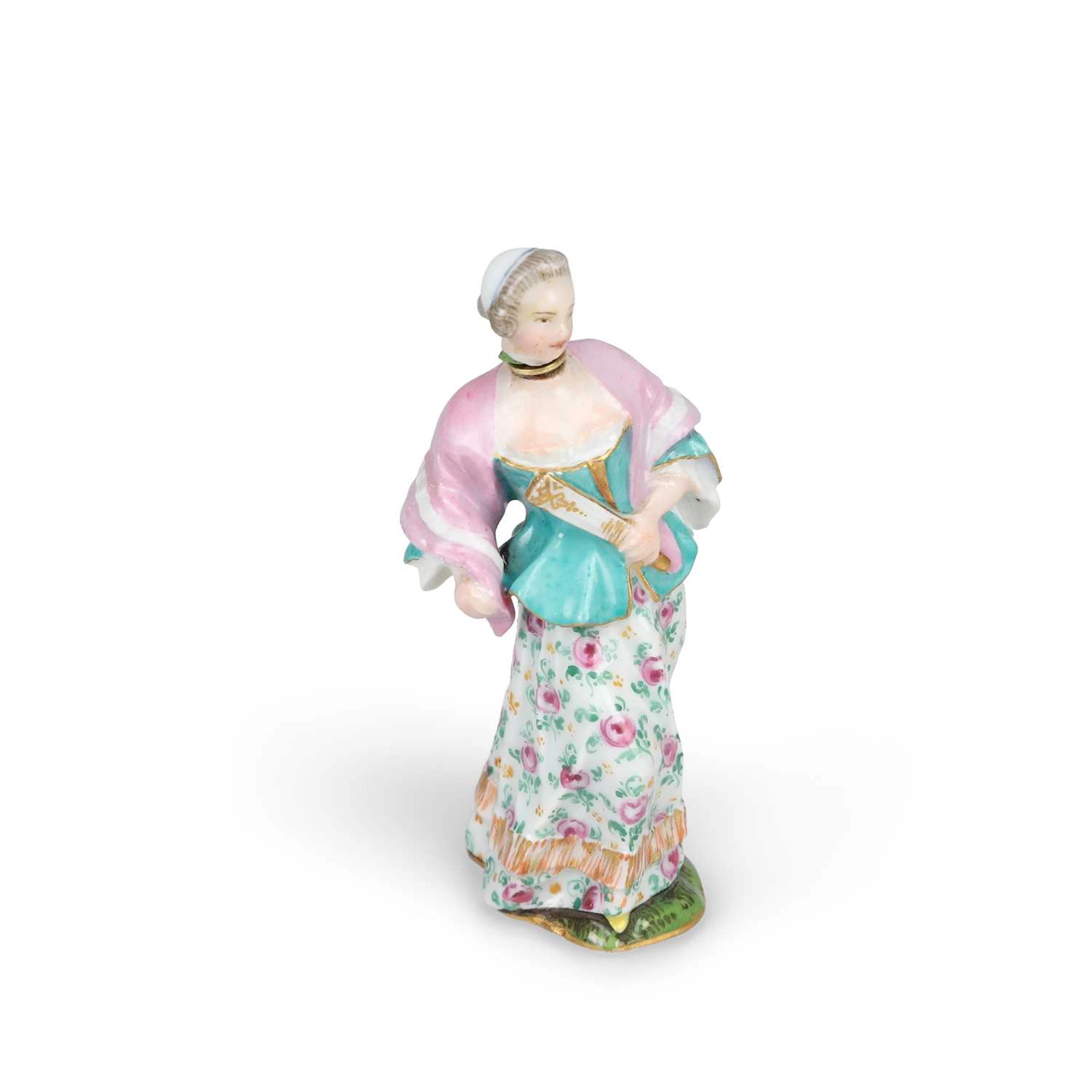 A PORCELAIN SCENT BOTTLE MODELLED AS A LADY WITH A FAN