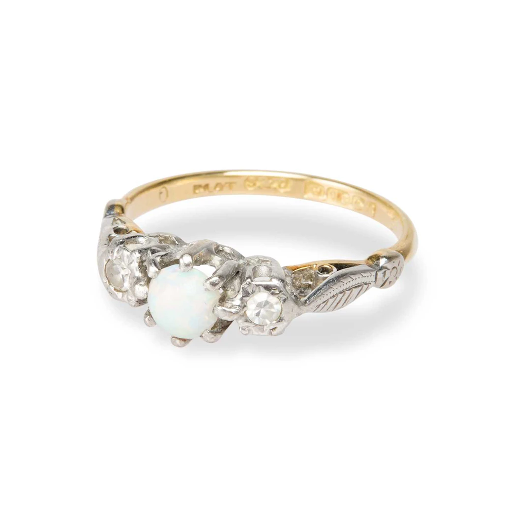 AN 18 CARAT GOLD OPAL AND DIAMOND RING