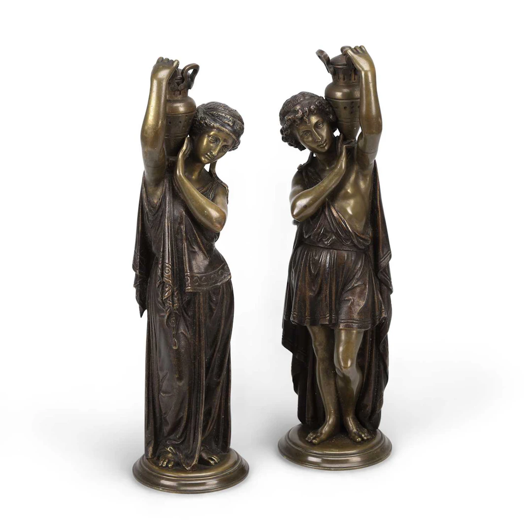 A PAIR OF BRONZE FIGURES OF CLASSICAL WATER CARRIERS