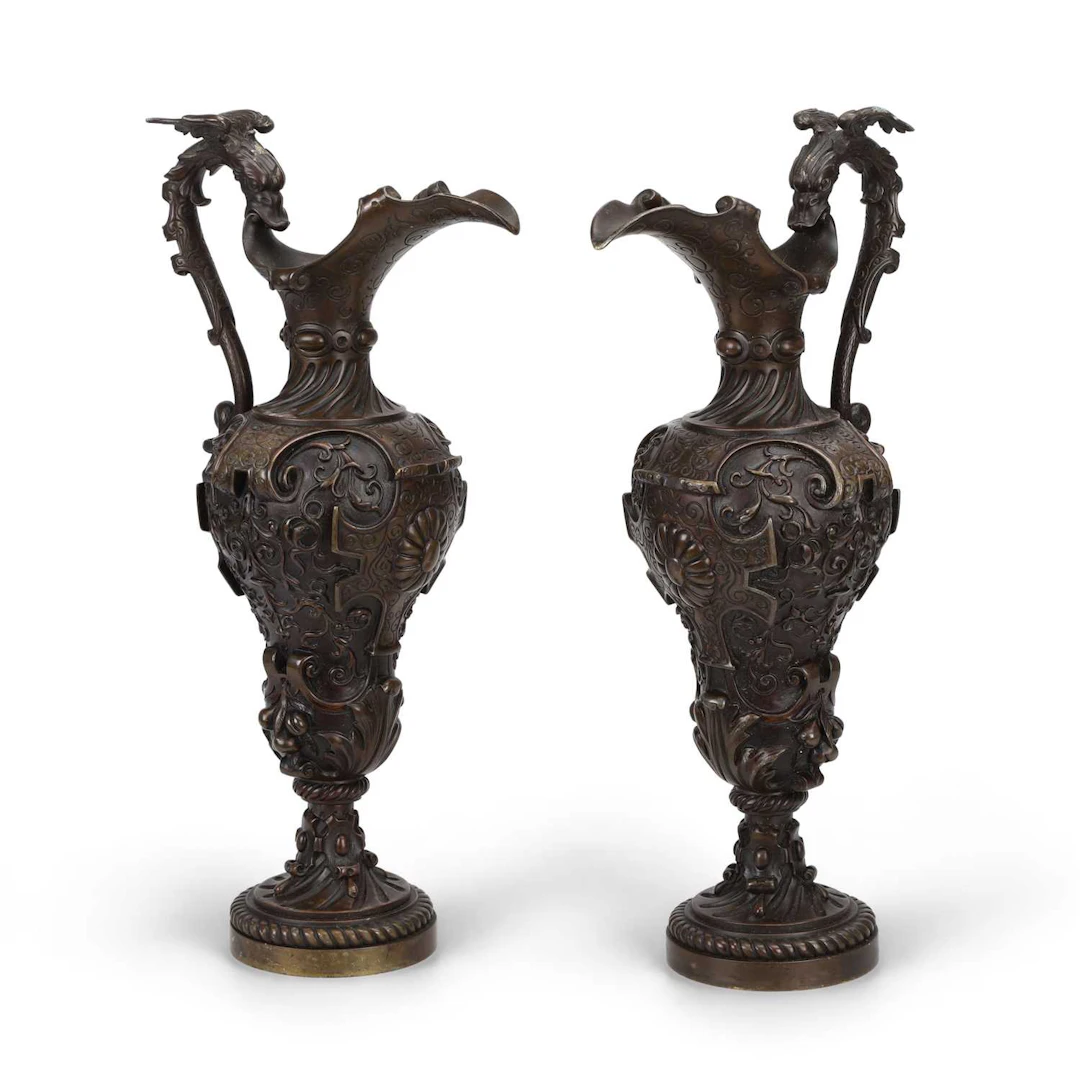 A PAIR OF BRONZE EWERS IN THE RENAISSANCE TASTE
