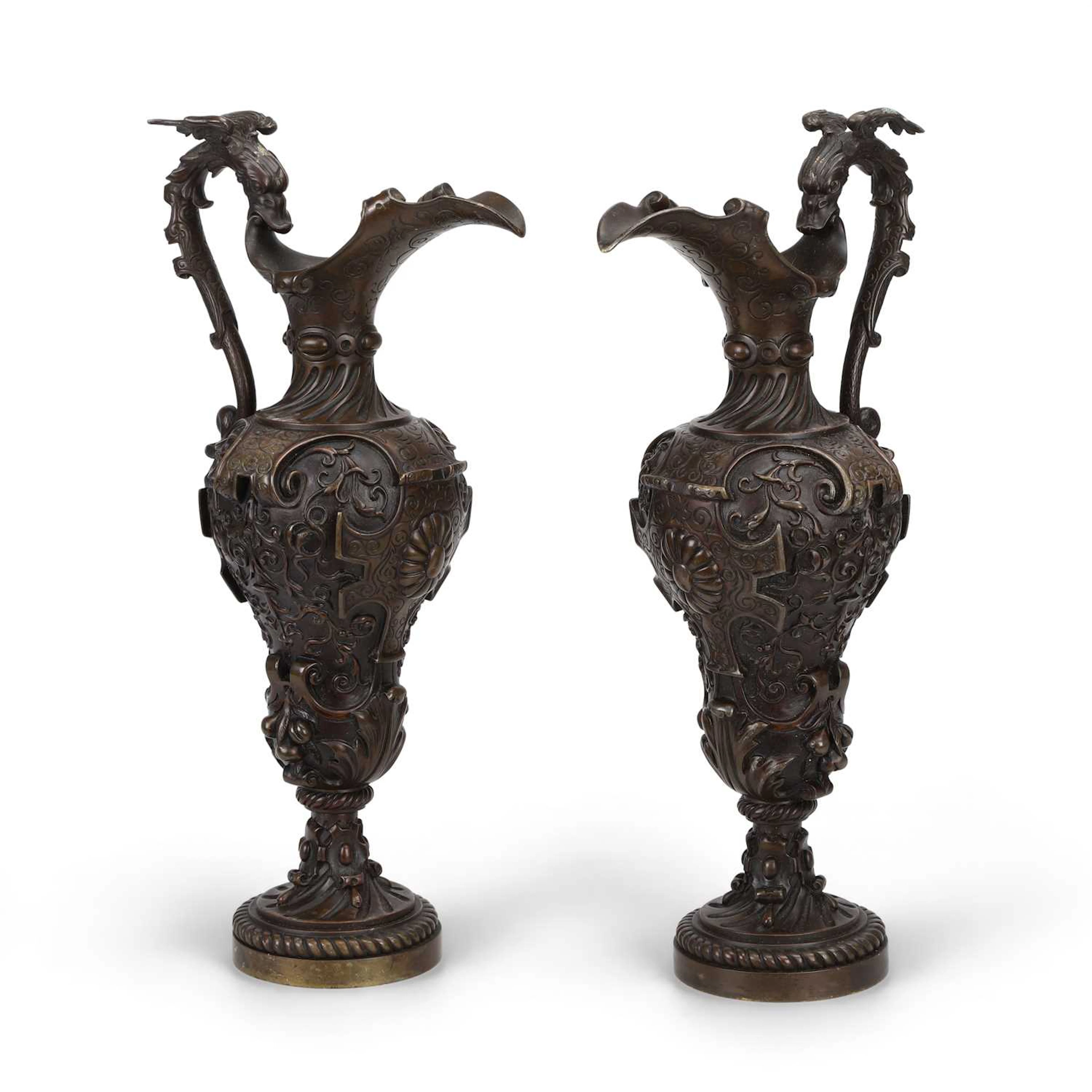 A PAIR OF BRONZE EWERS IN THE RENAISSANCE TASTE