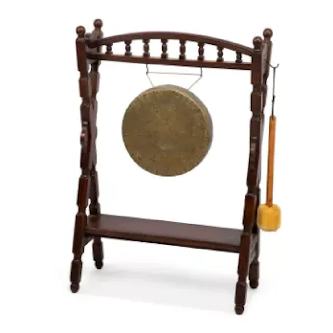 A DINNER GONG ON AN OAK STAND