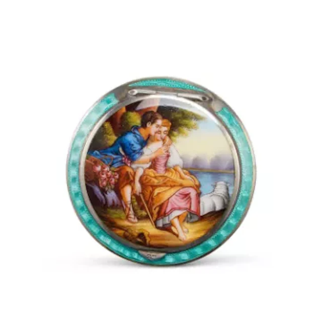 A CONTINENTAL SILVER AND GUILLOCHÉ ENAMEL COMPACT