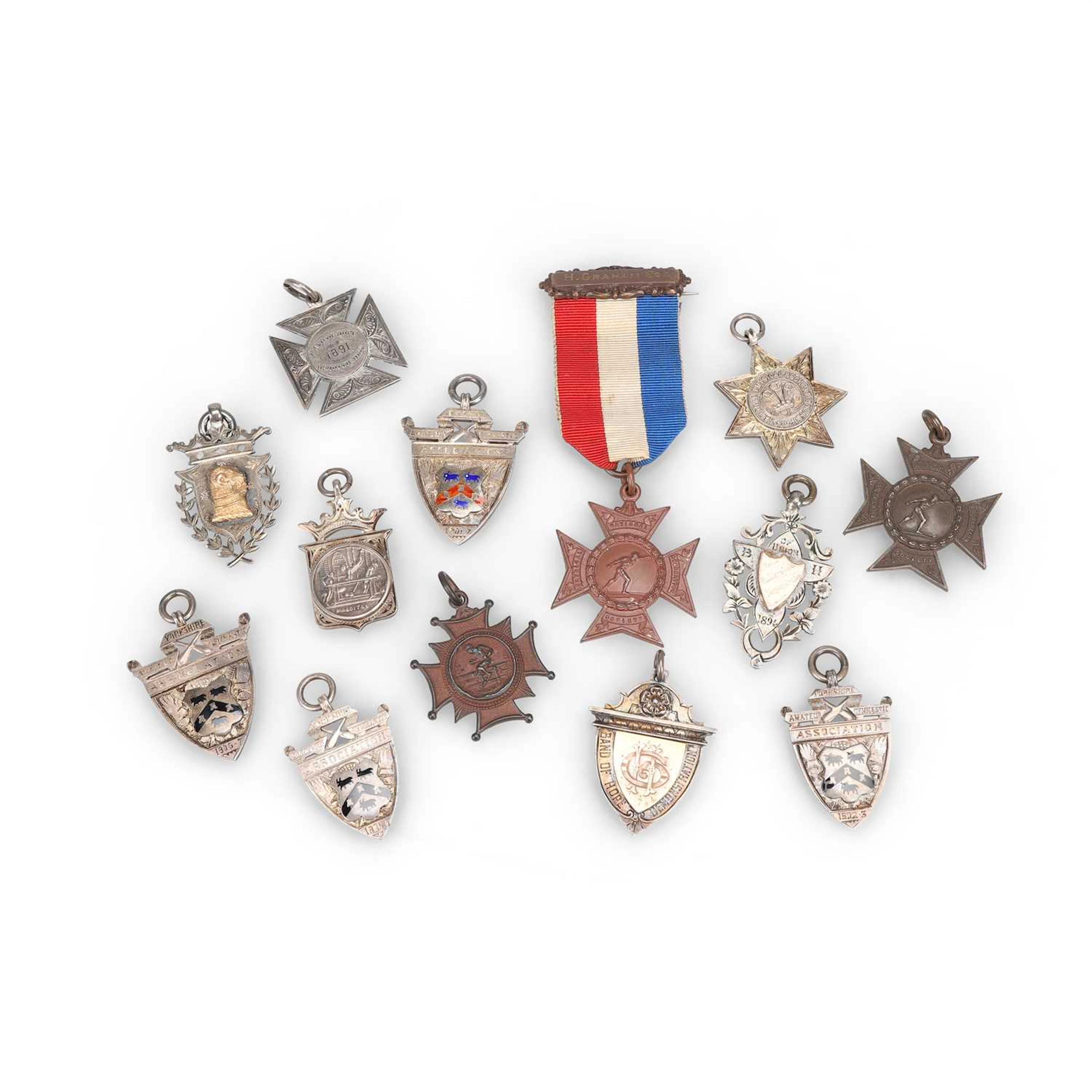 A GROUP OF FOBS AND MEDALLIONS