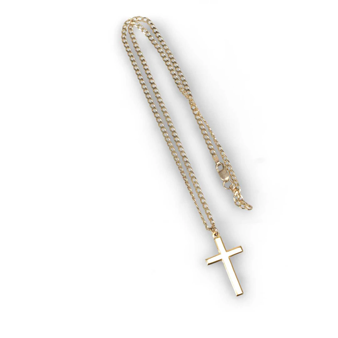 A 22 CARAT GOLD CROSS PENDANT ON A 9 CARAT GOLD CUBAN LINK CHAIN