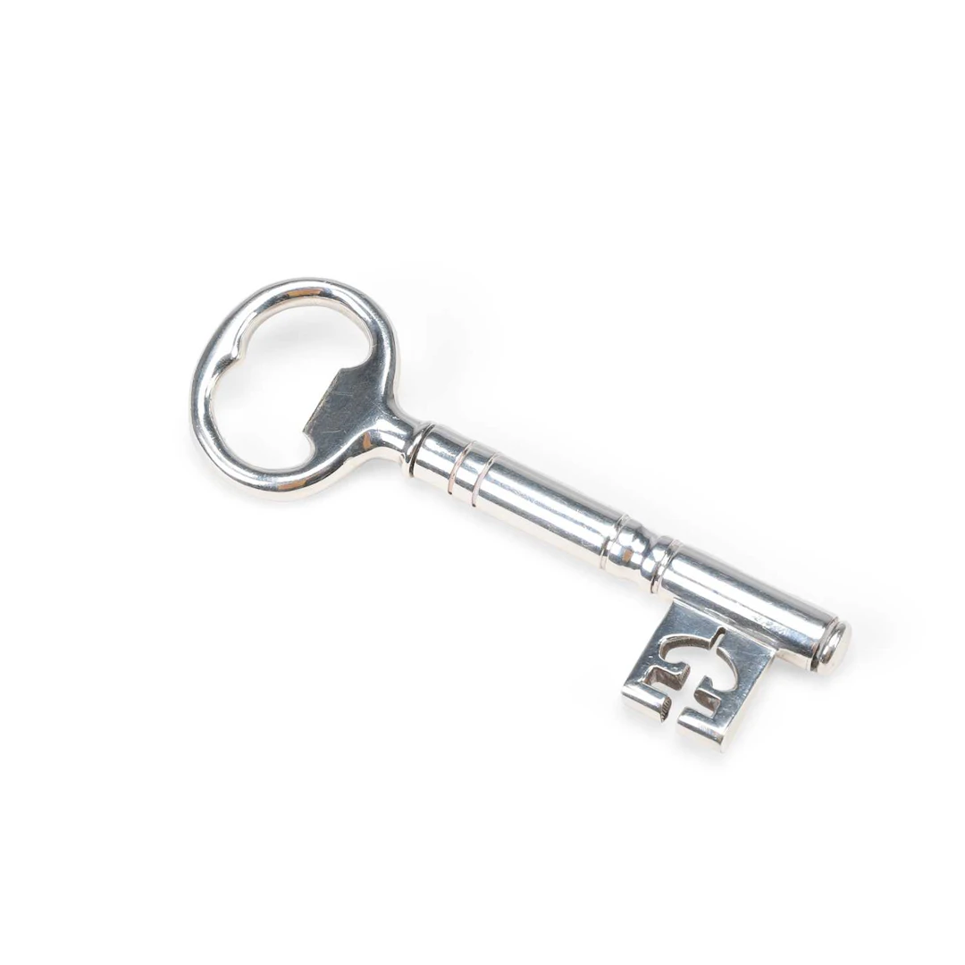 A SILVER-PLATED NOVELTY COMBINATION CORKSCREW AND BOTTLE OPENER