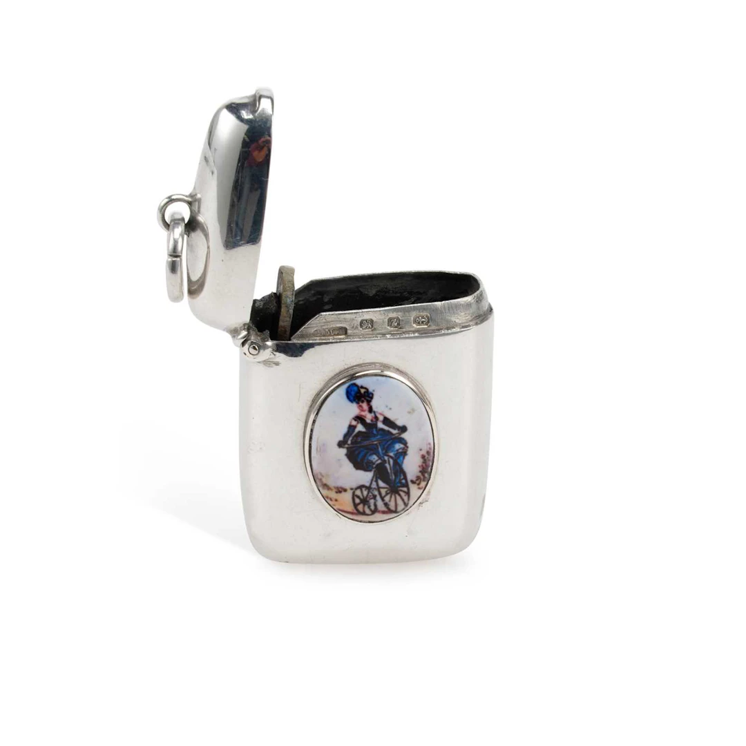 A LATE VICTORIAN SILVER AND ENAMEL VESTA CASE