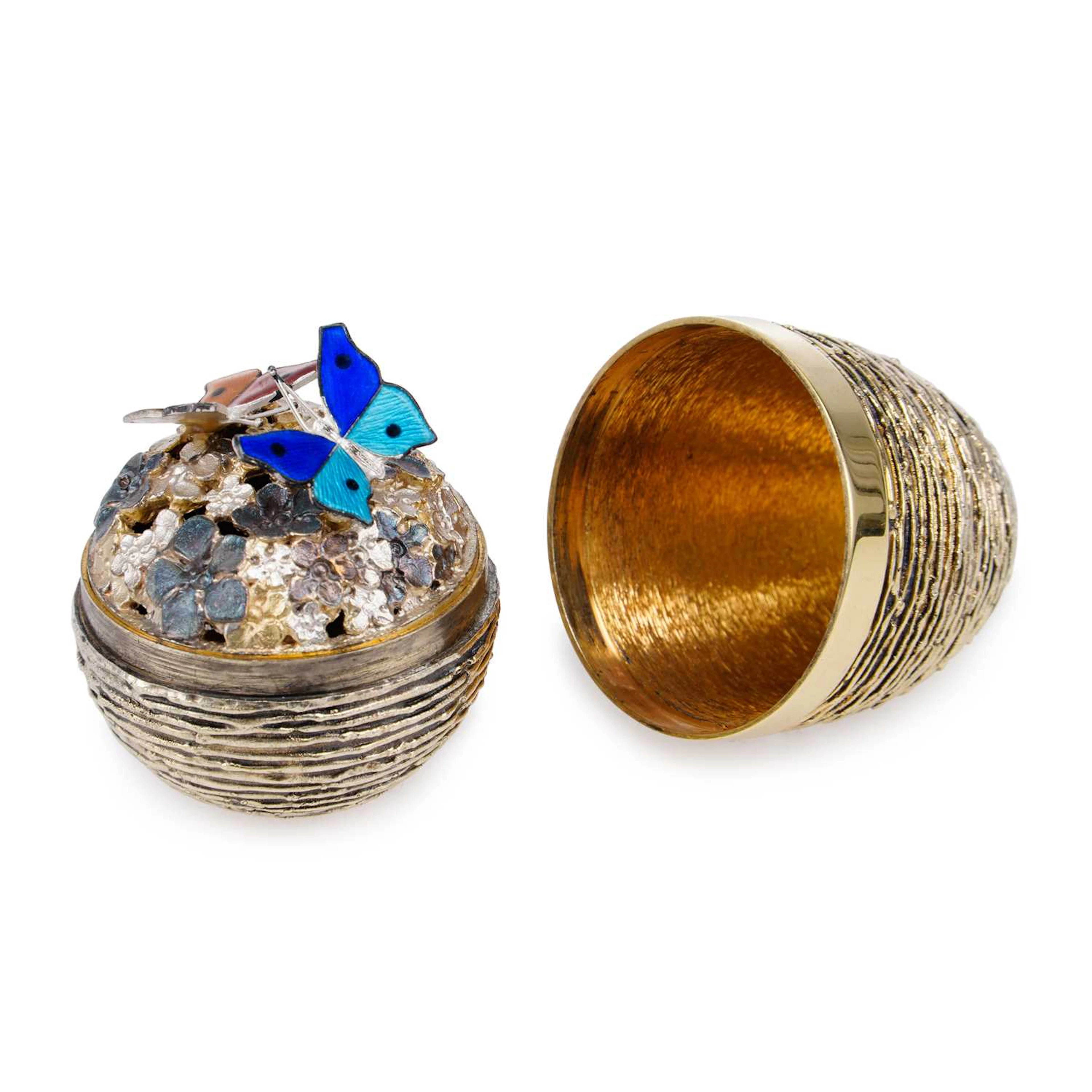 STUART DEVLIN: AN ELIZABETH II SILVER-GILT AND ENAMEL SURPRISE EGG
