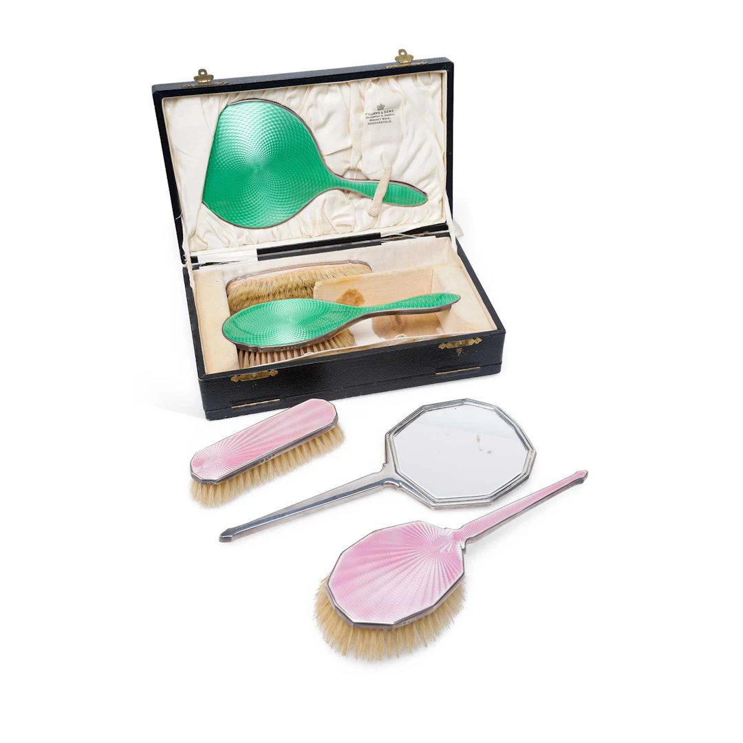 TWO ART DECO SILVER AND GUILLOCHÉ ENAMEL DRESSING TABLE SETS