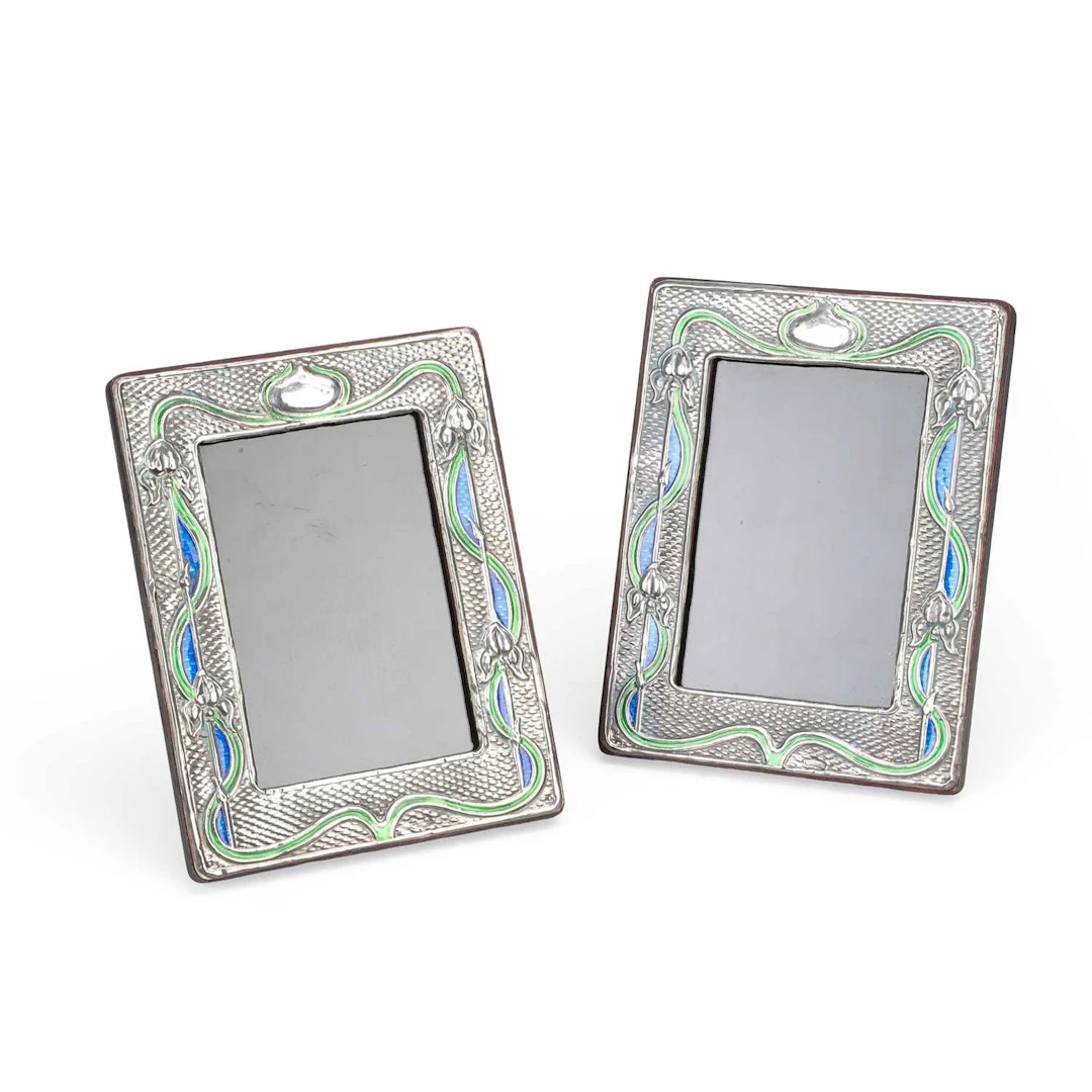 A PAIR OF MODERN ART NOUVEAU STYLE SILVER-MOUNTED ENAMELLED PHOTOGRAPH FRAMES