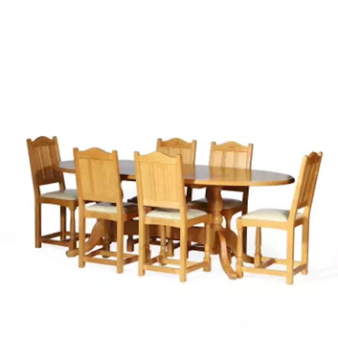 A GRAHAM DUNCALF SWANMAN OAK DINING TABLE AND SIX CHAIRS