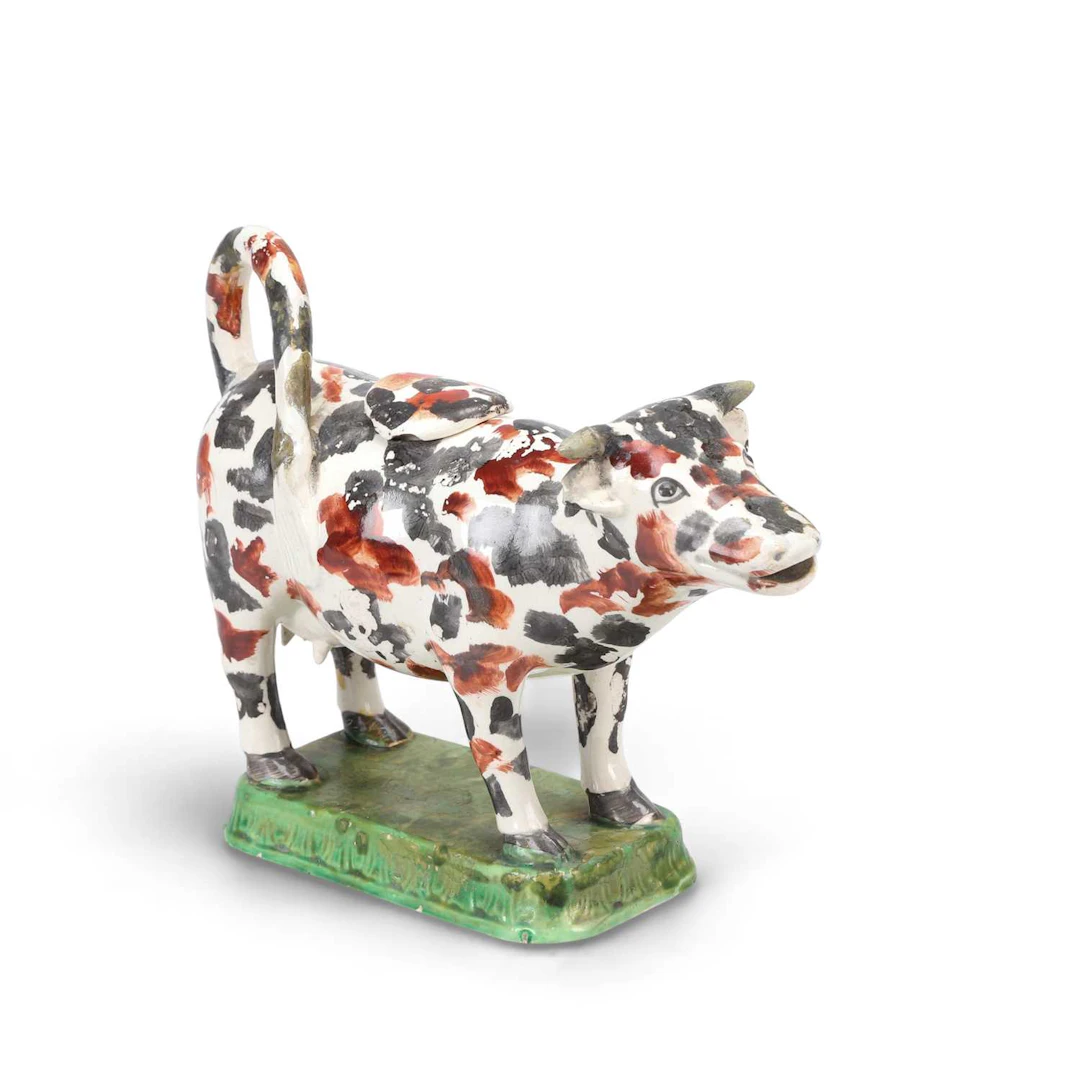 A PRATTWARE COW CREAMER AND COVER