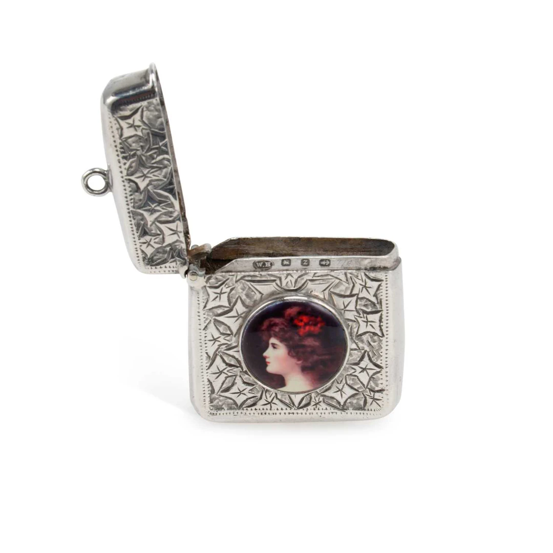 A LATE VICTORIAN SILVER AND ENAMEL VESTA CASE