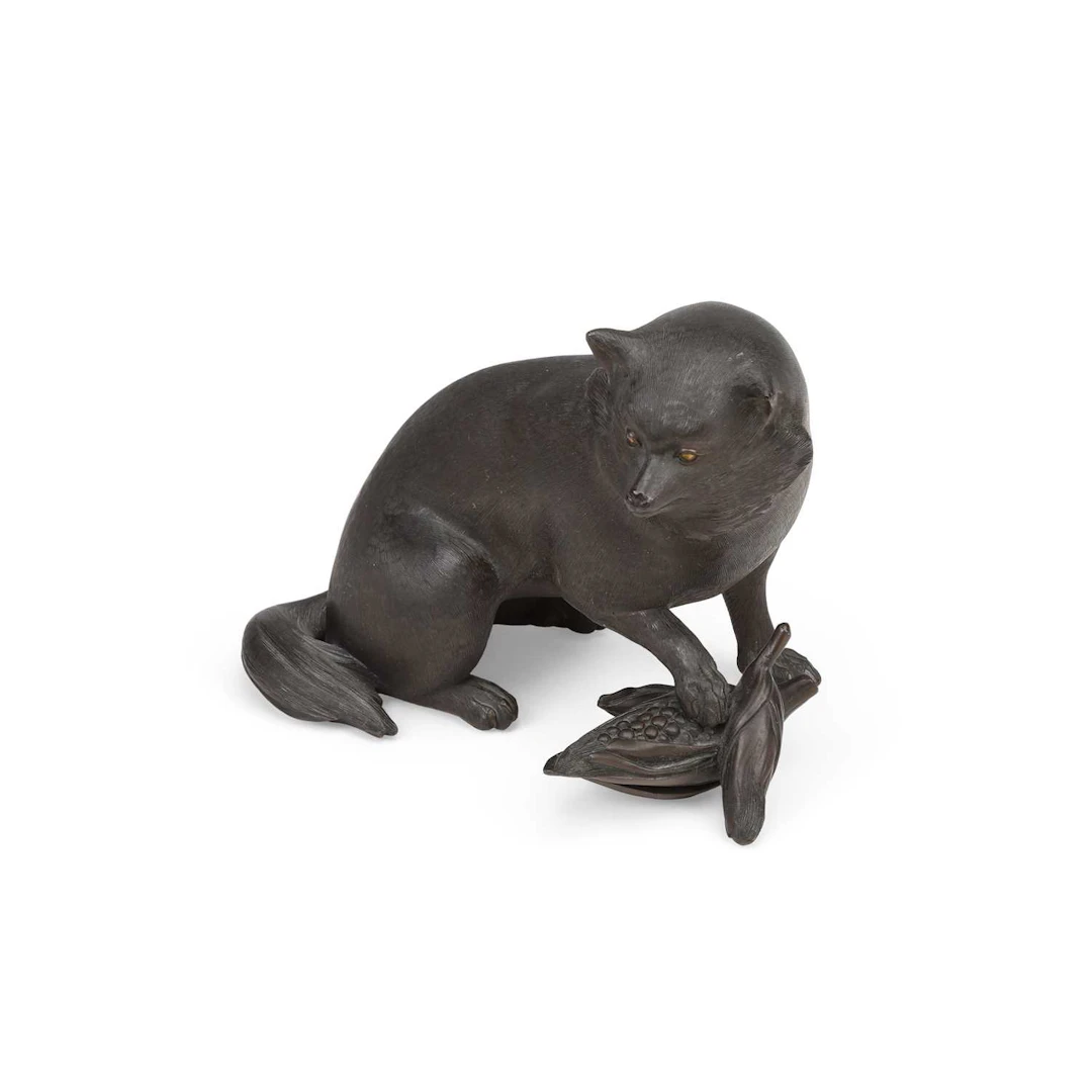 A JAPANESE BRONZE OKIMONO OF A TANUKI