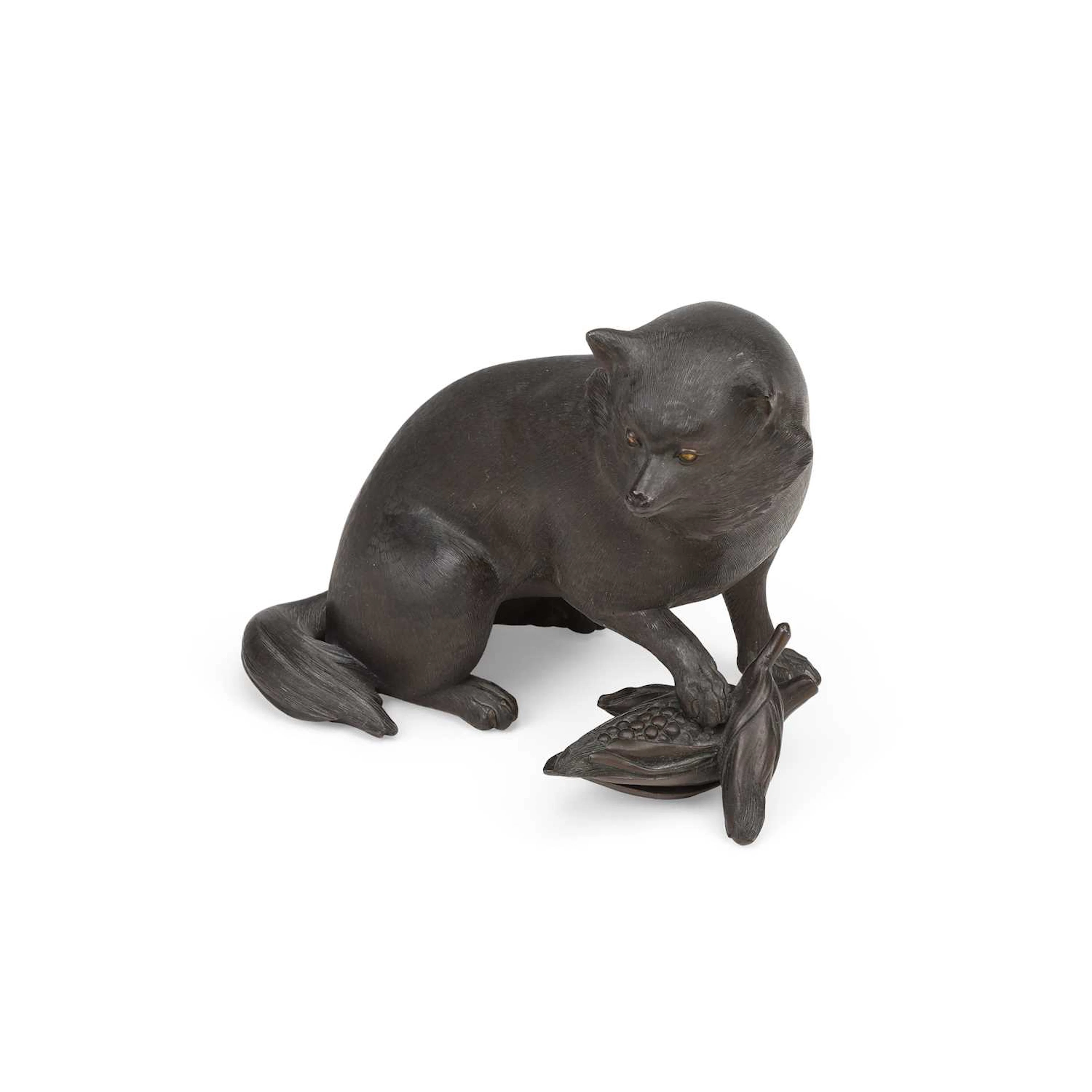 A JAPANESE BRONZE OKIMONO OF A TANUKI