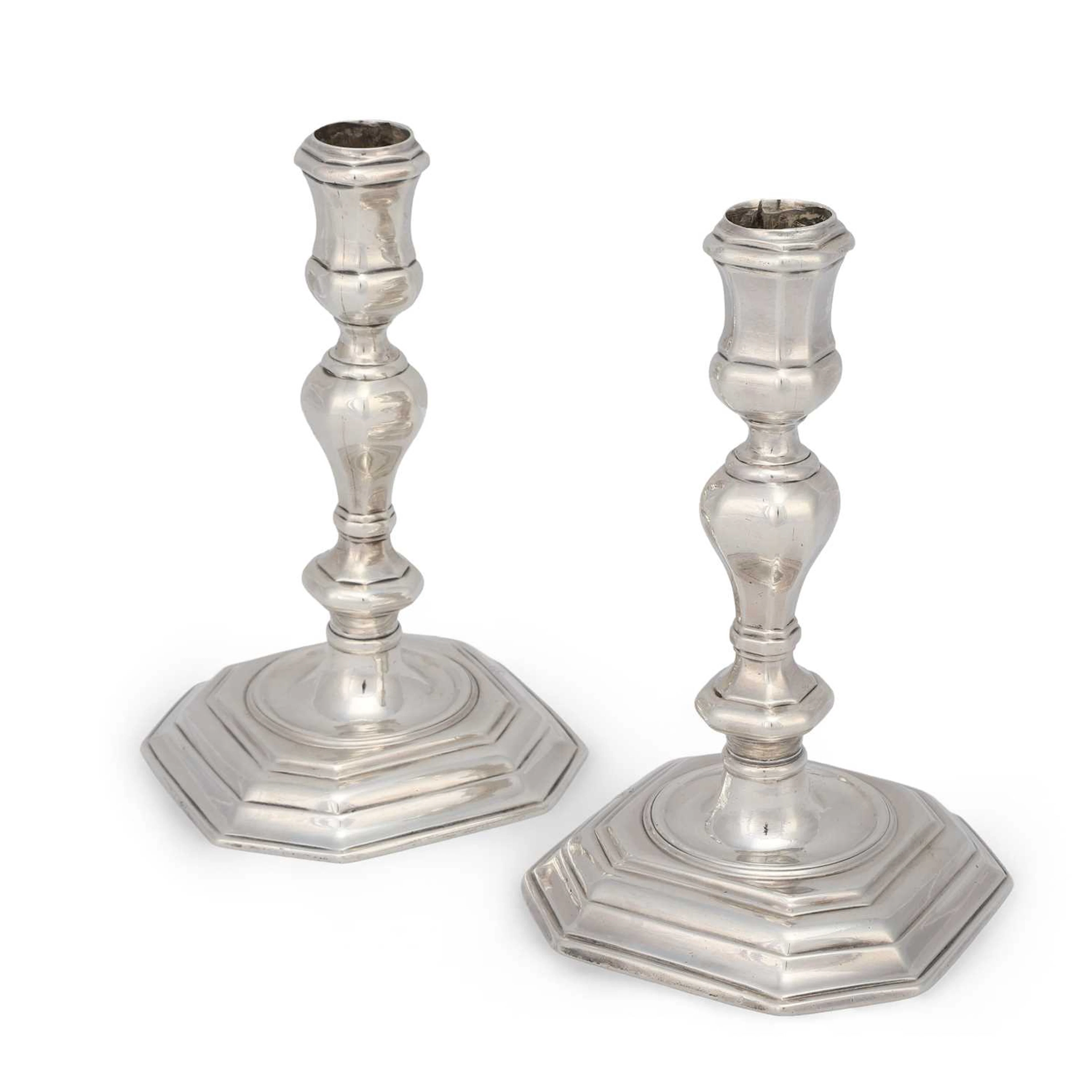 A PAIR OF QUEEN ANNE SILVER CANDLESTICKS