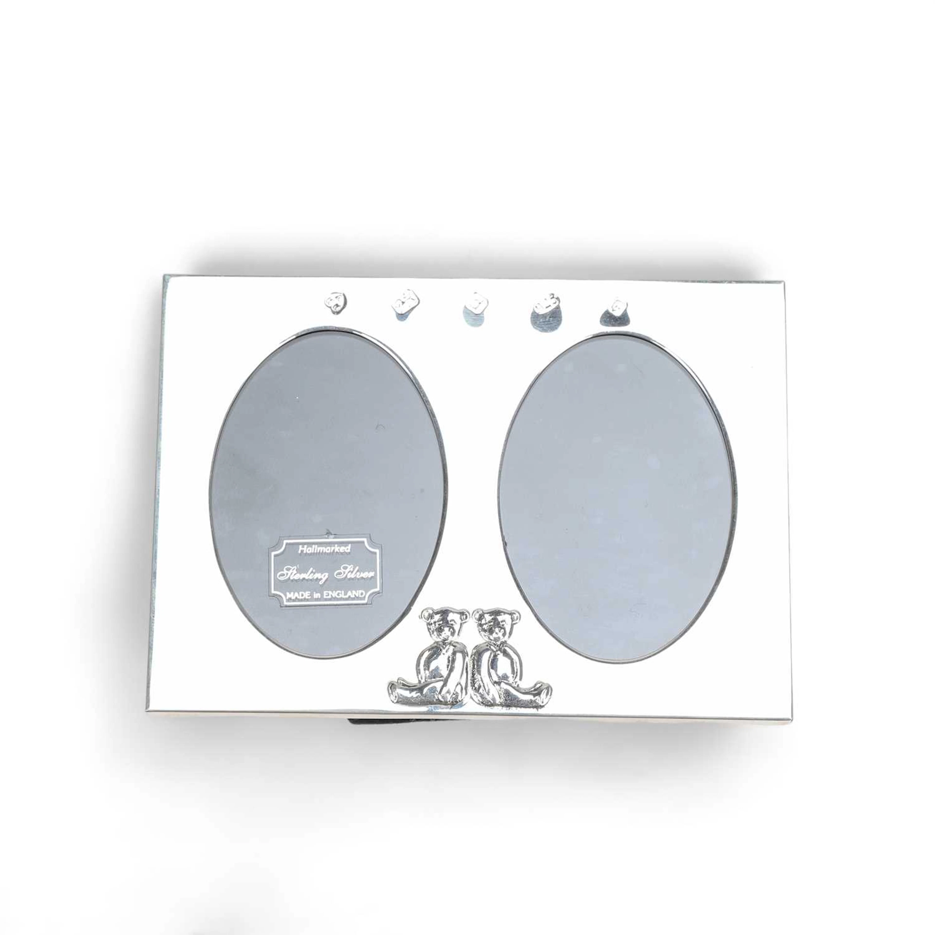A MODERN SILVER DOUBLE PHOTOGRAPH FRAME