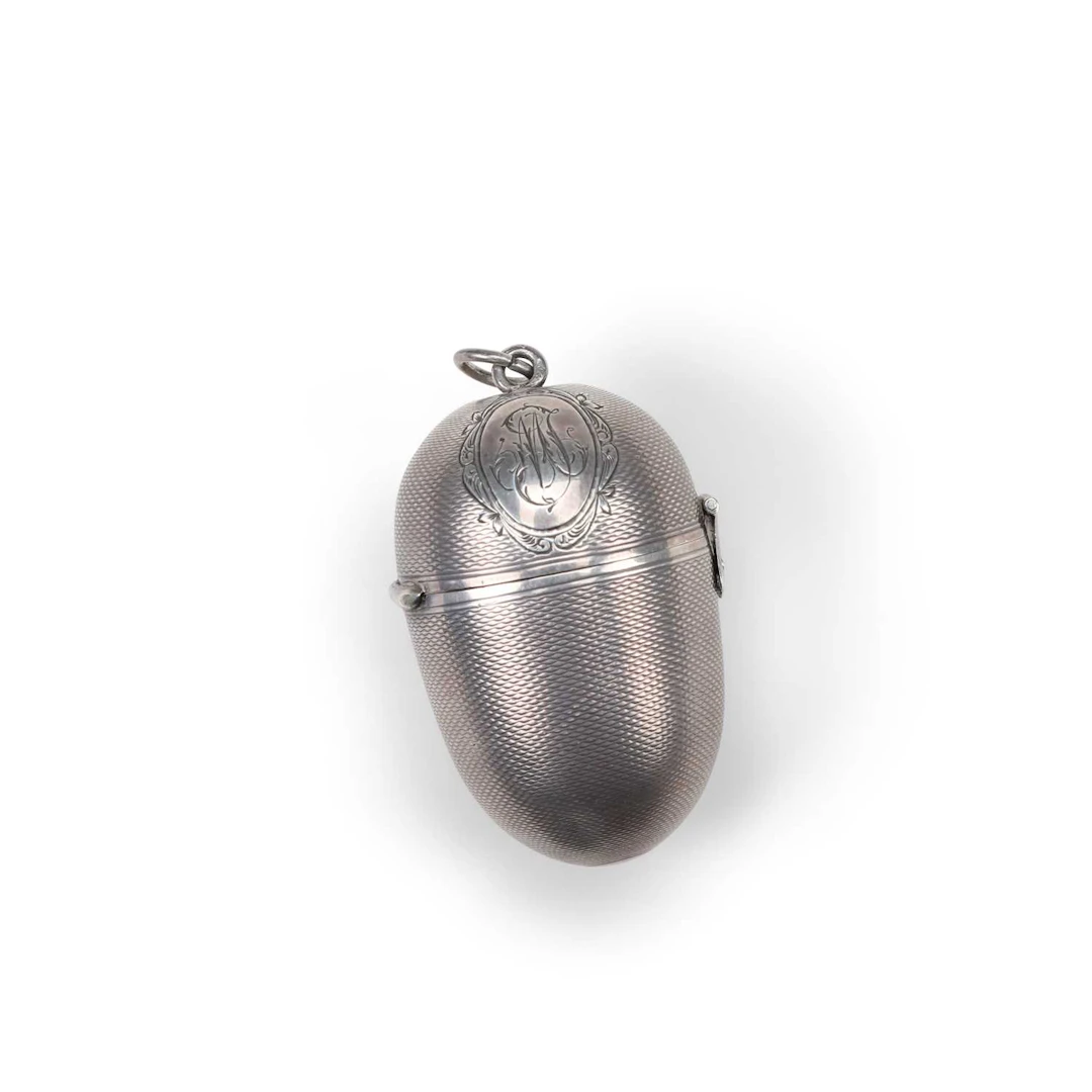 A FRENCH SILVER EGG SHAPED SEWING NECESSAIRE RETAILED BY LAURENT