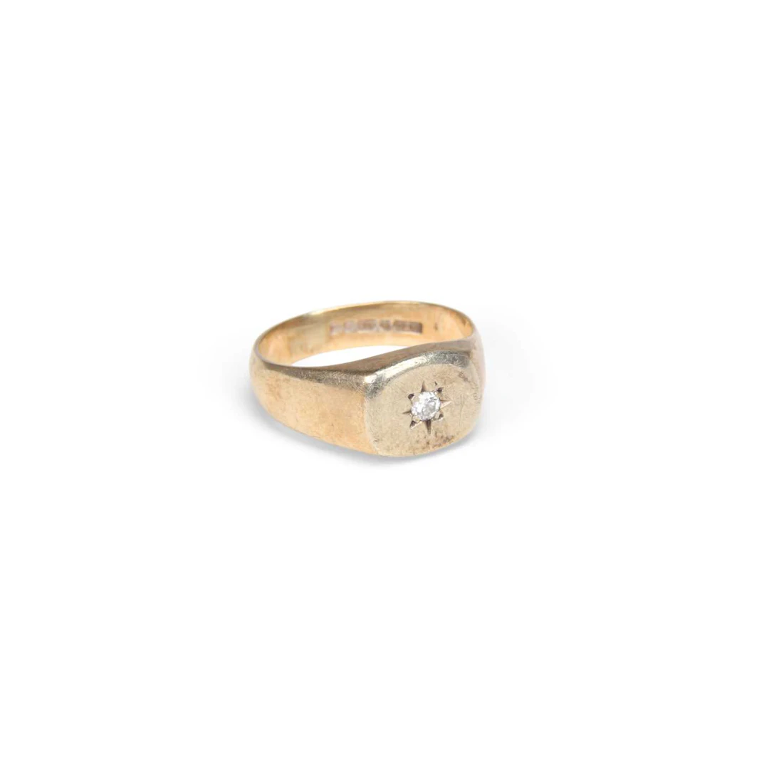 A 9CT GOLD DIAMOND SIGNET RING