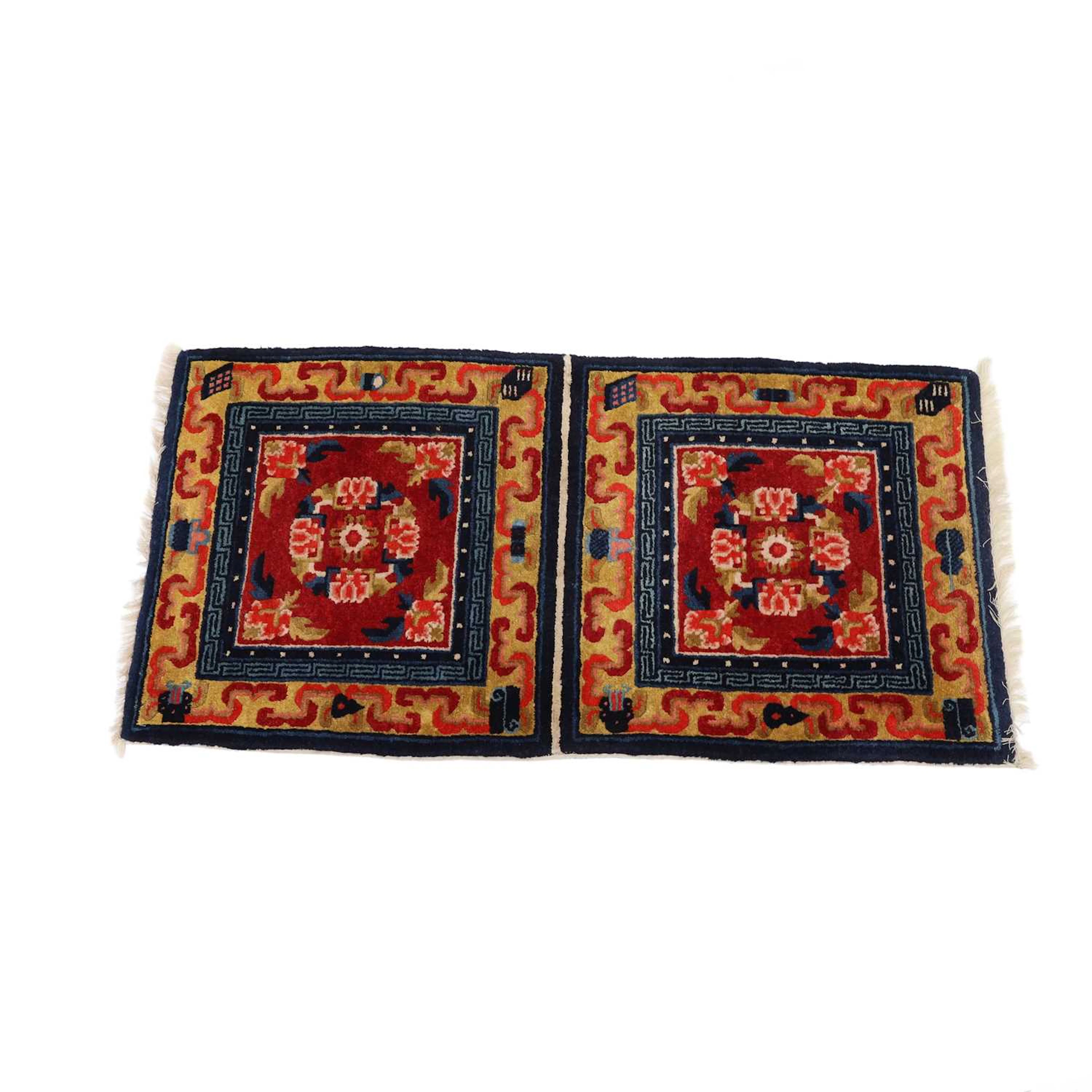 A TIBETAN TWO-PANEL SEAT RUG