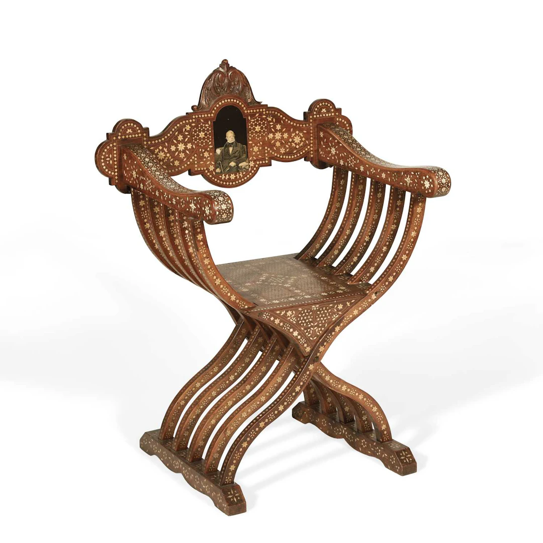 A BONE INLAID X-FRAME CHAIR