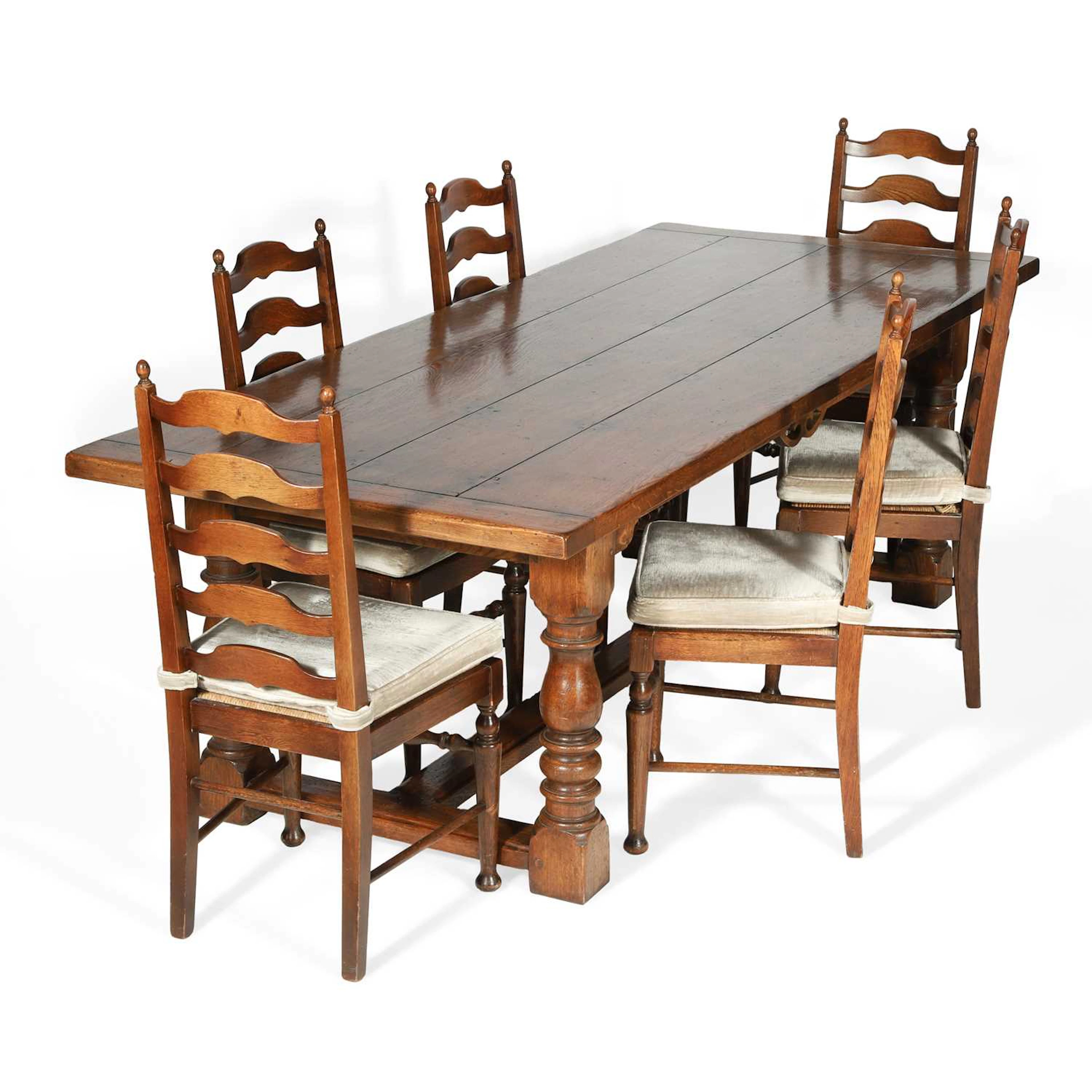 AN OAK REFECTORY DINING TABLE AND SIX CHAIRS