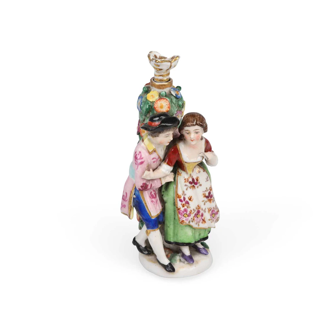 A CONTINENTAL PORCELAIN SCENT BOTTLE MODELLED AS A GALLANT AND HIS COMPANION