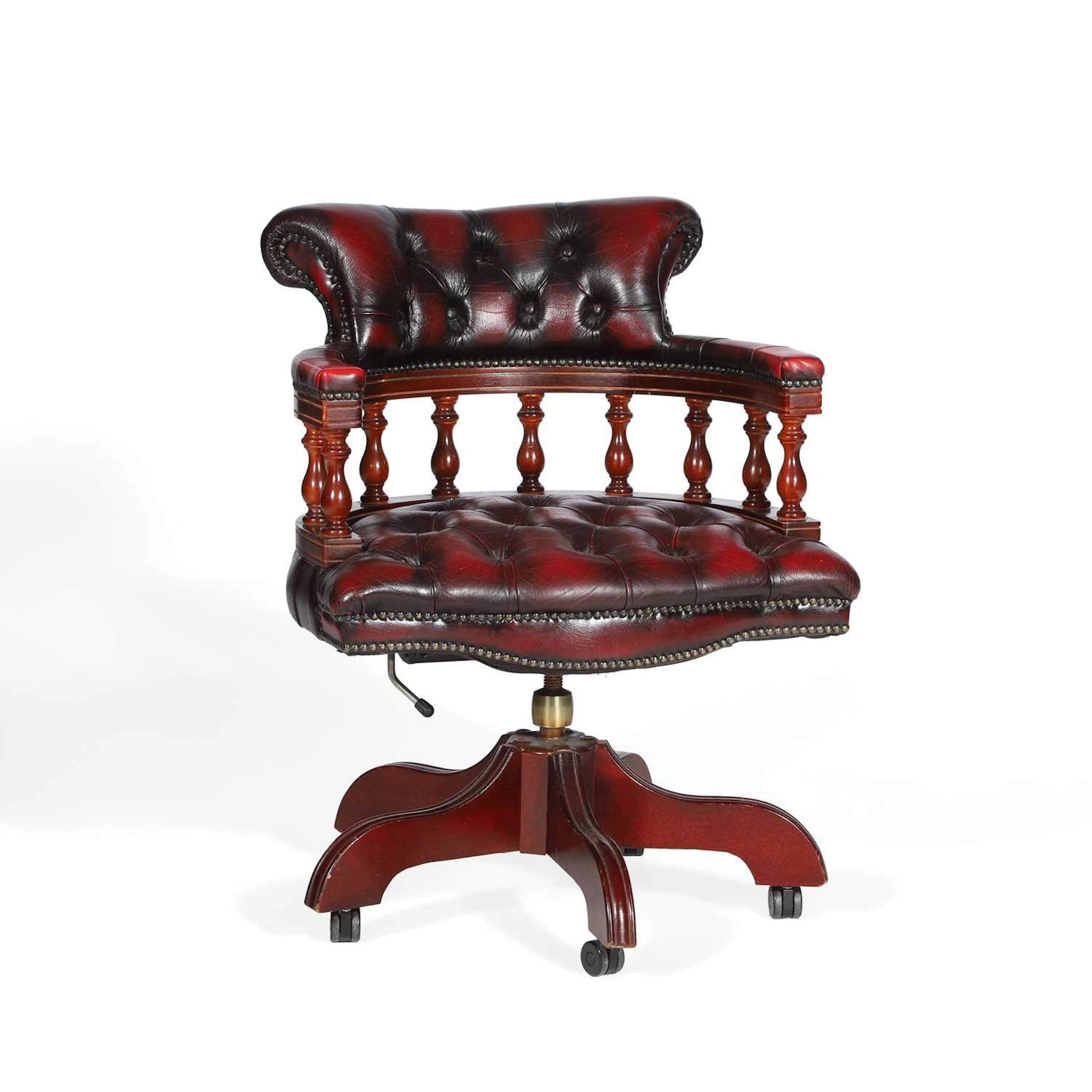A RED LEATHER CAPTAIN'S DESK CHAIR