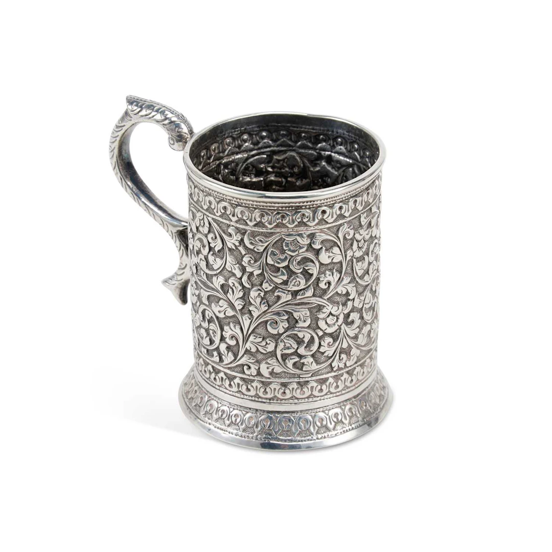 AN INDIAN SILVER TANKARD