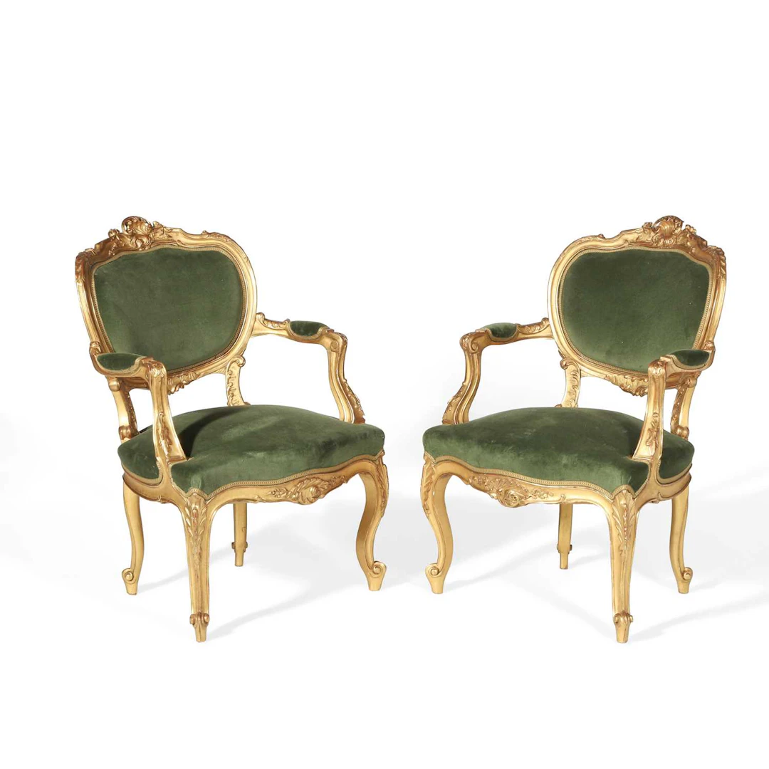 A PAIR OF ROCOCO STYLE GILTWOOD OPEN ARMCHAIRS
