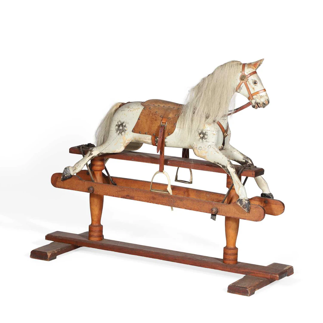 A PAINTED WOOD ROCKING HORSE
