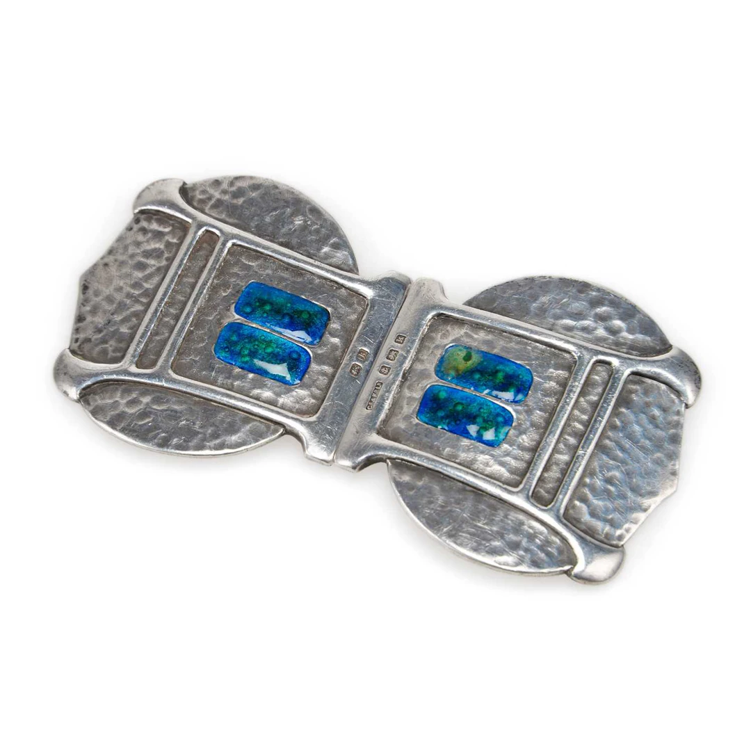 AN ARTS AND CRAFTS SILVER AND ENAMEL BUCKLE