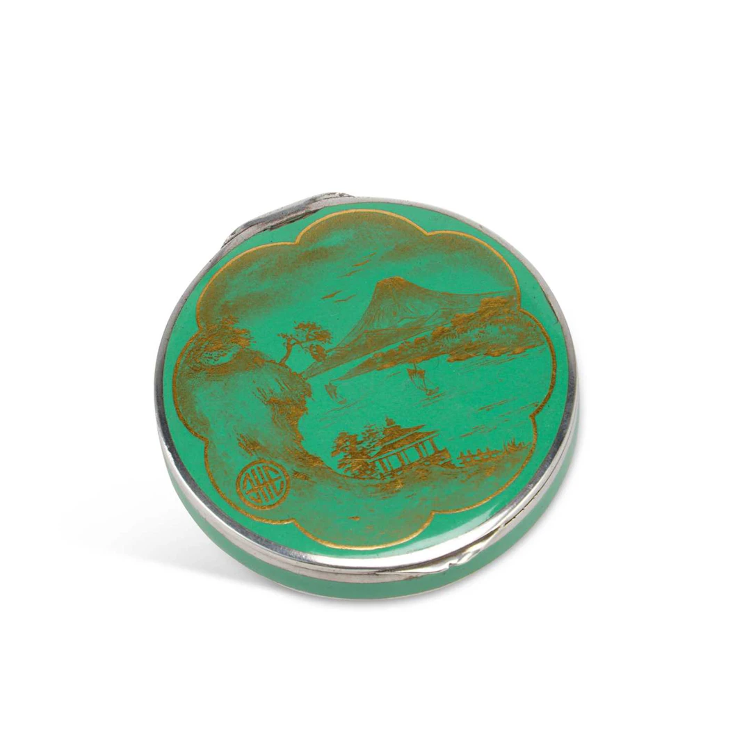 A CONTINENTAL SILVER AND ENAMEL COMPACT