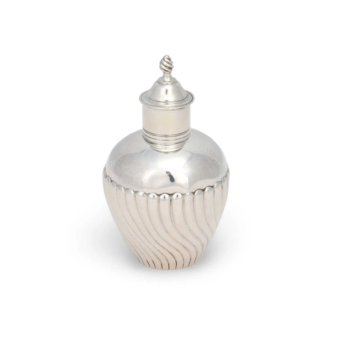 A GEORGE III SILVER TEA CADDY