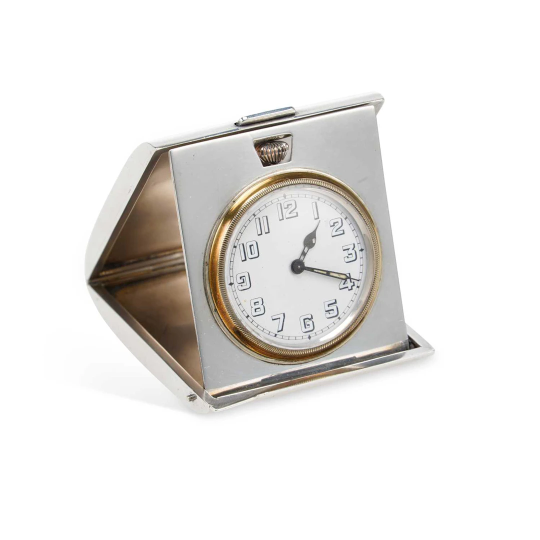 AN ART DECO SILVER TRAVELLING CLOCK