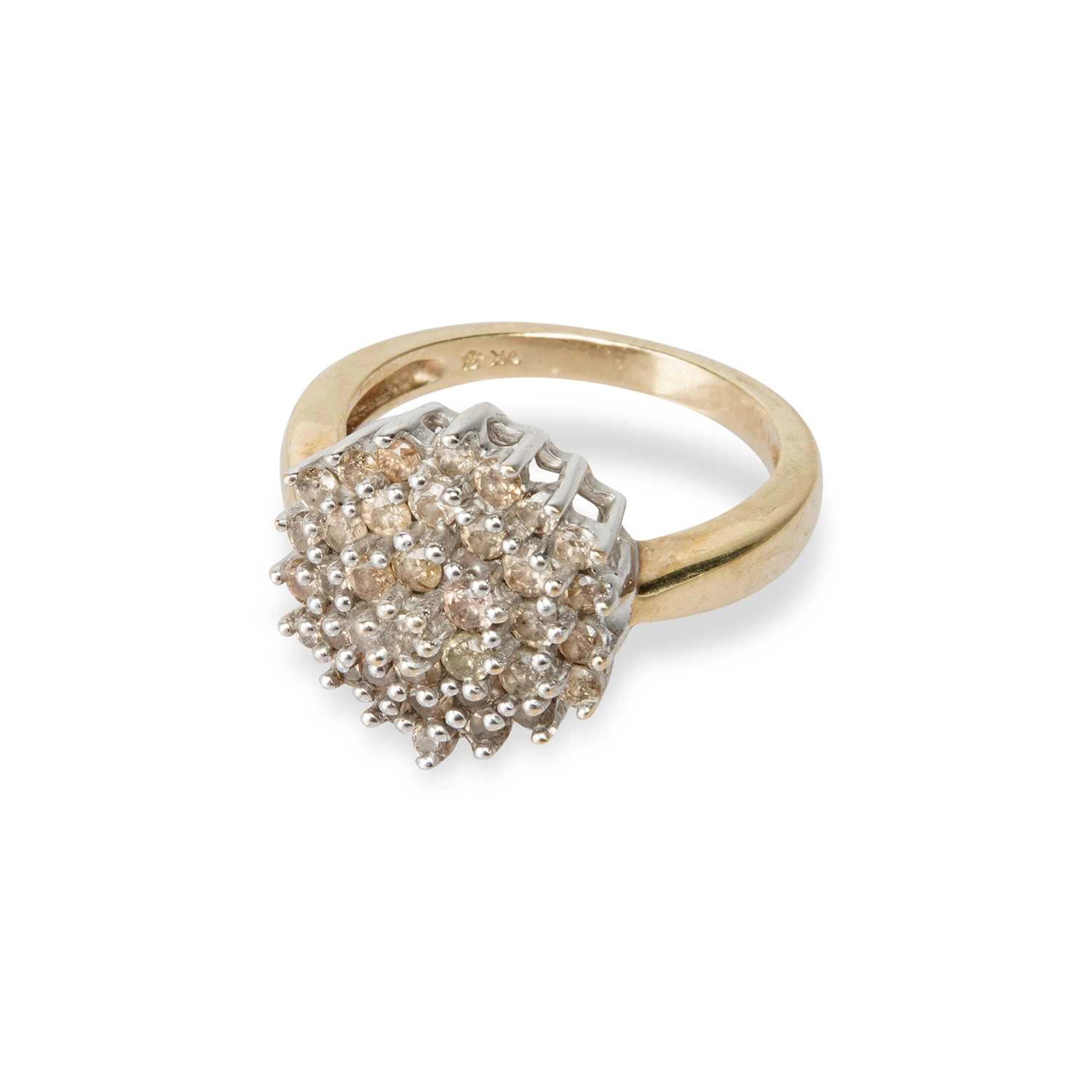 A 9 CARAT GOLD DIAMOND CLUSTER RING