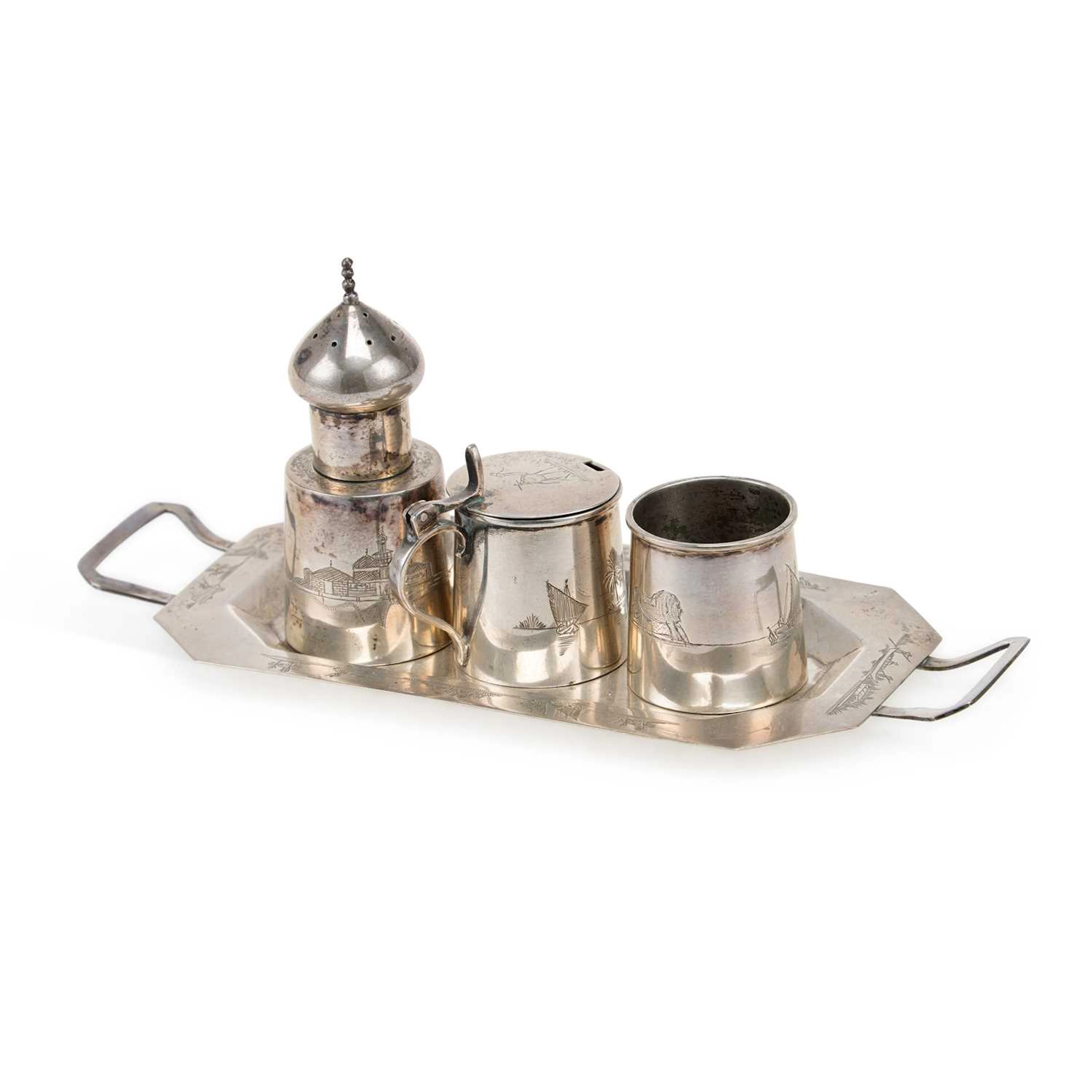 AN IRAQI SILVER THREE-PIECE CONDIMENT SET ON TRAY