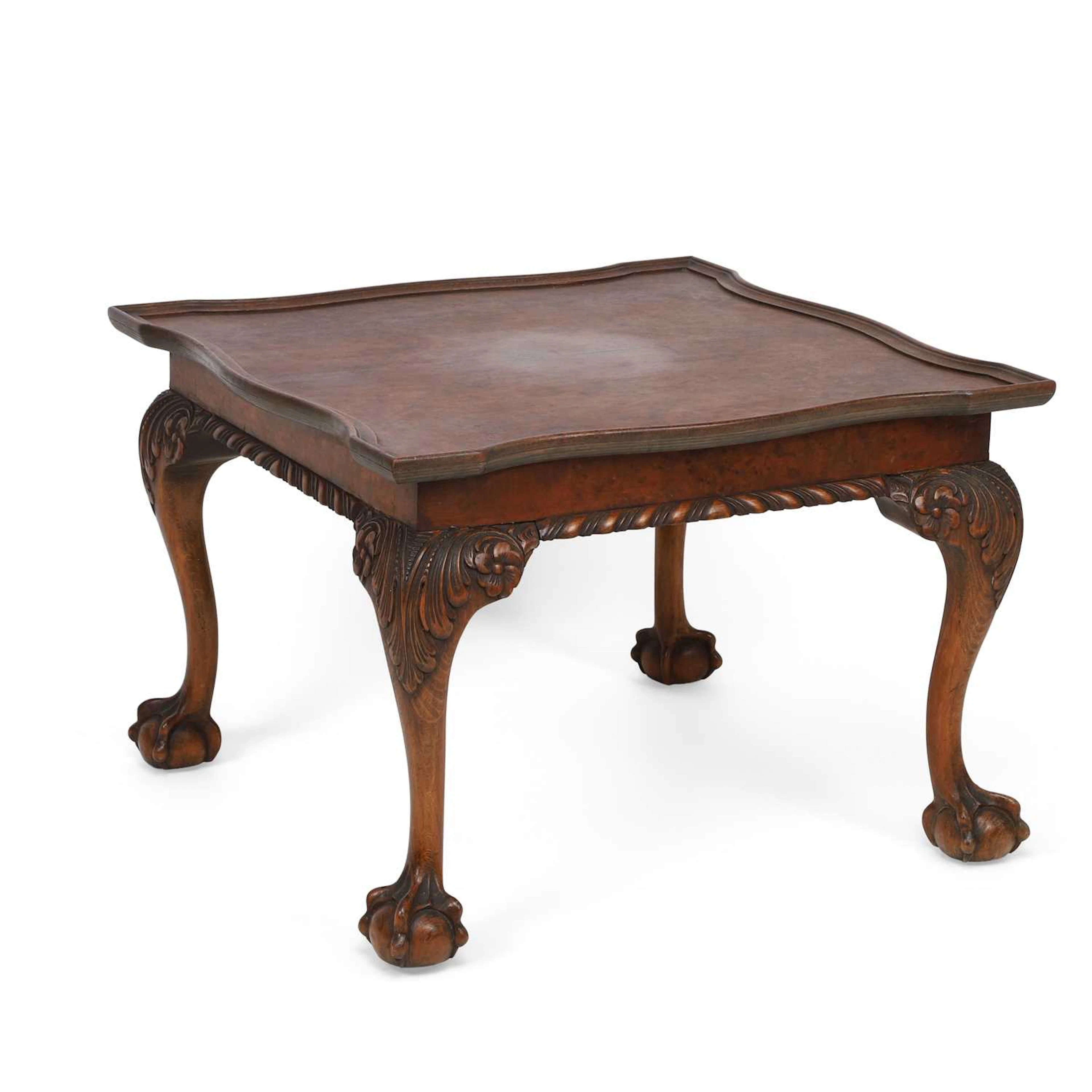 A WALNUT COFFEE TABLE