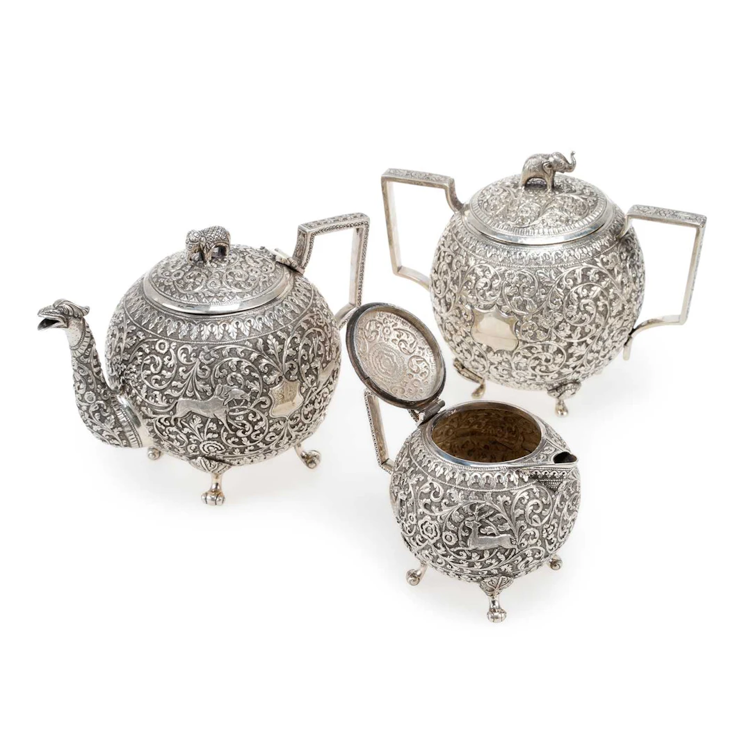 AN INDIAN SILVER MATCHED THREE-PIECE TEA SERVICE