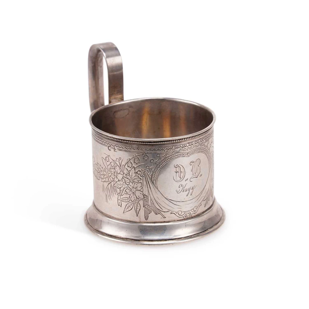 A RUSSIAN SILVER TEA GLASS HOLDER