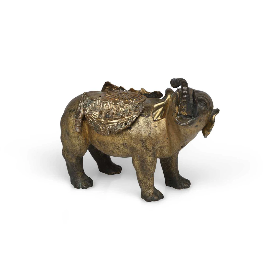 A CHINESE GILT BRONZE MODEL OF A CAPARISONED ELEPHANT
