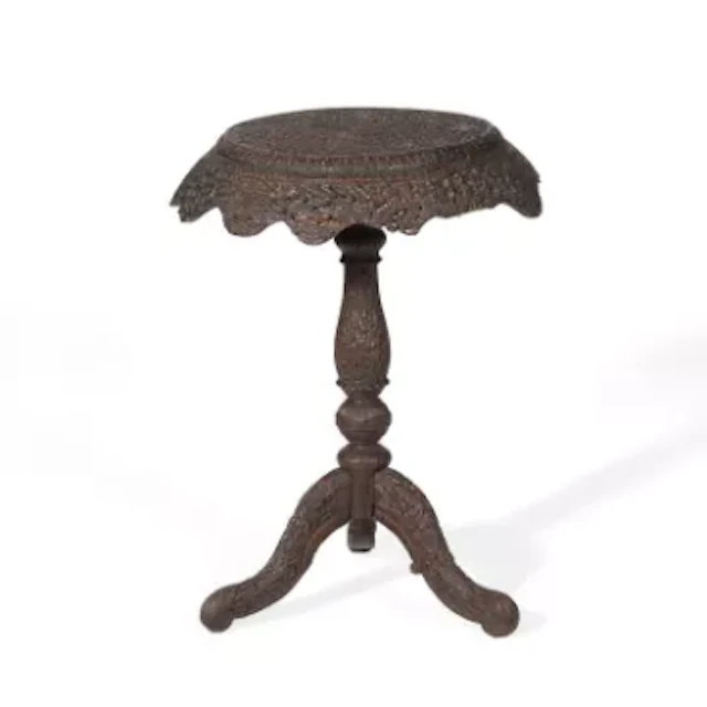 AN INDIAN CARVED HARDWOOD OCCASIONAL TABLE