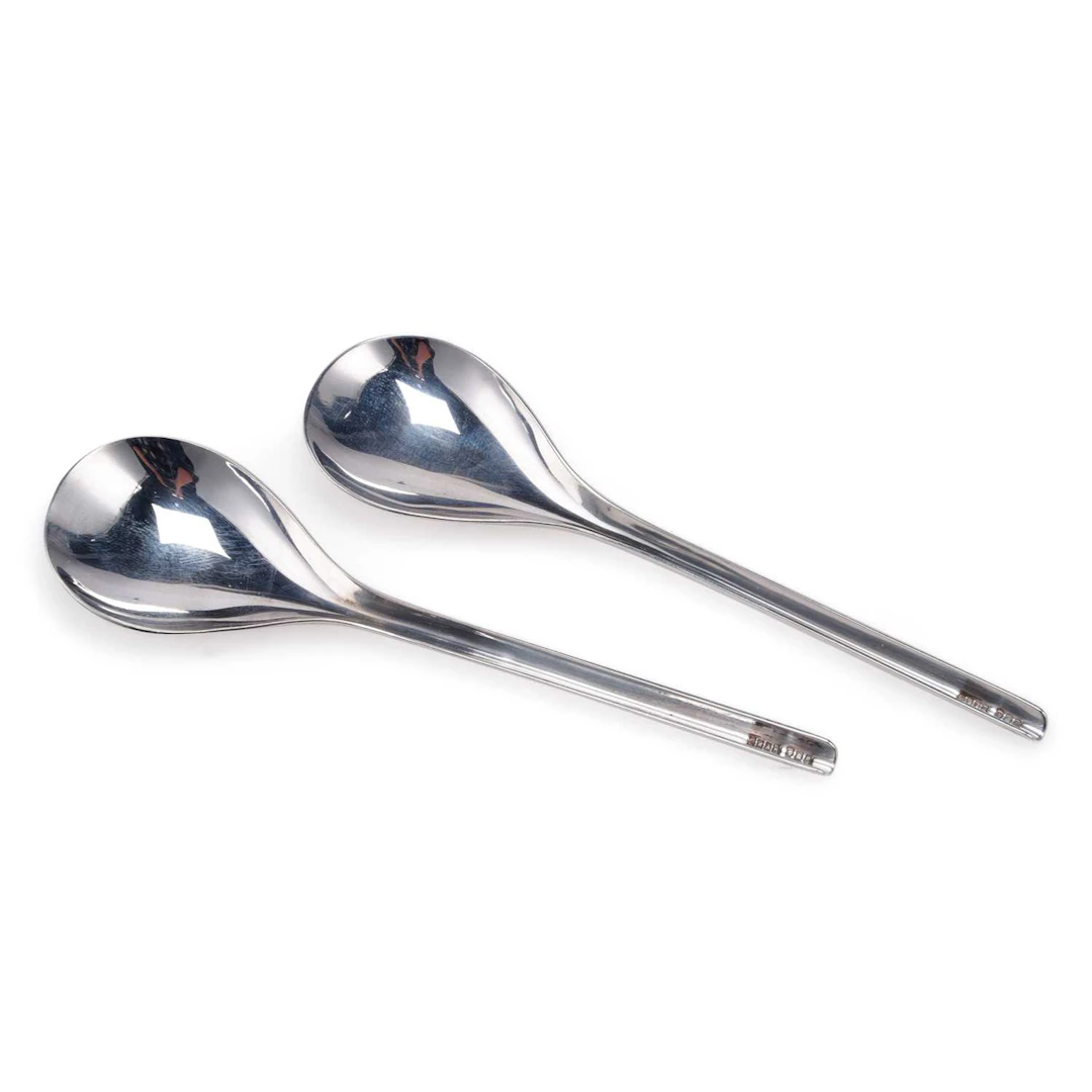A PAIR OF ELIZABETH II MODERNIST SILVER SPOONS