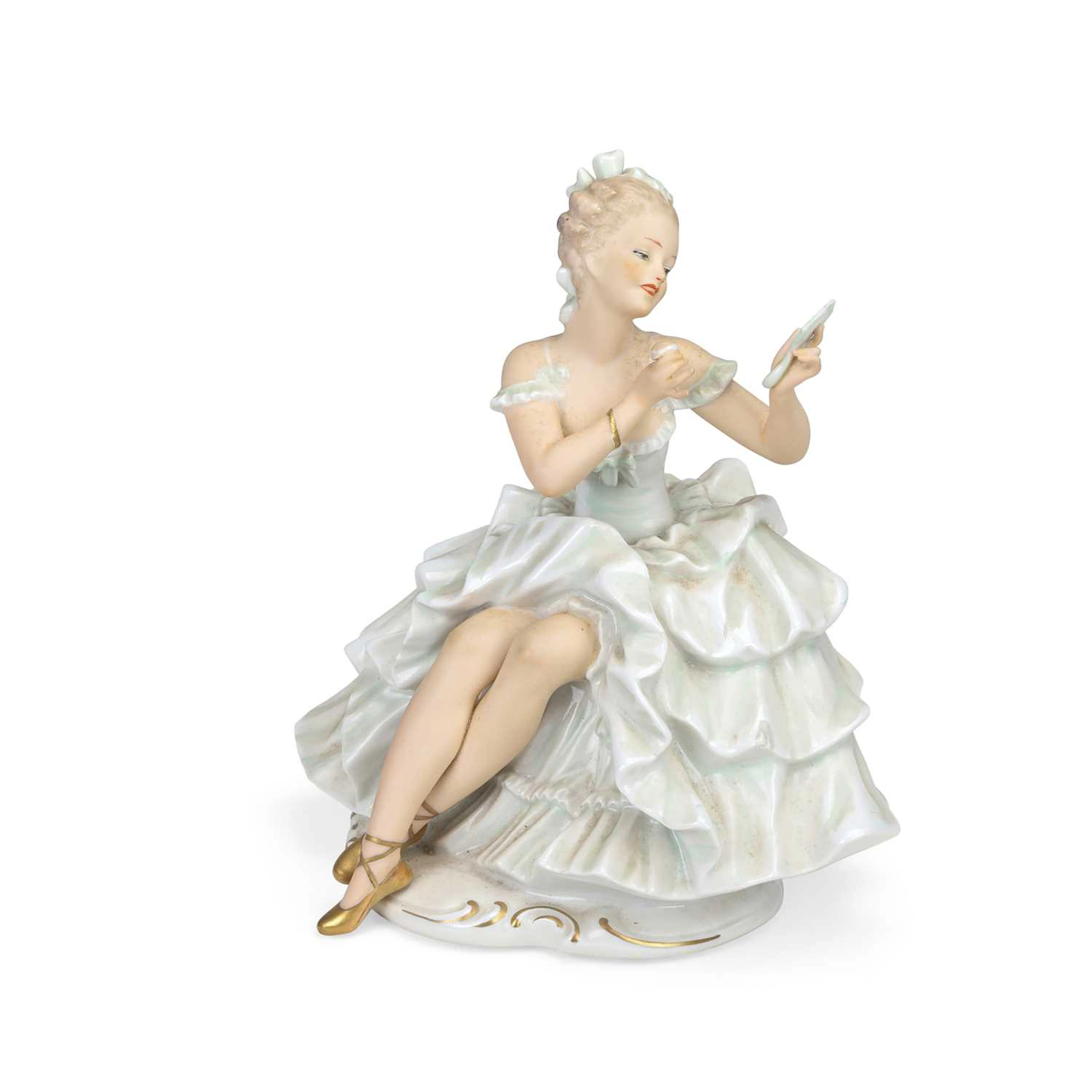 A WALLENDORF PORCELAIN FIGURE OF A SEATED LADY
