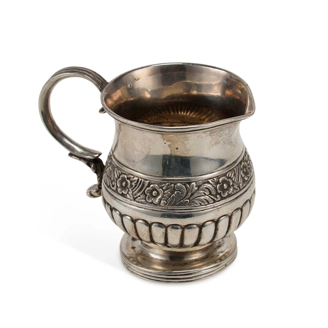 A COLONIAL INDIAN SILVER CREAM JUG